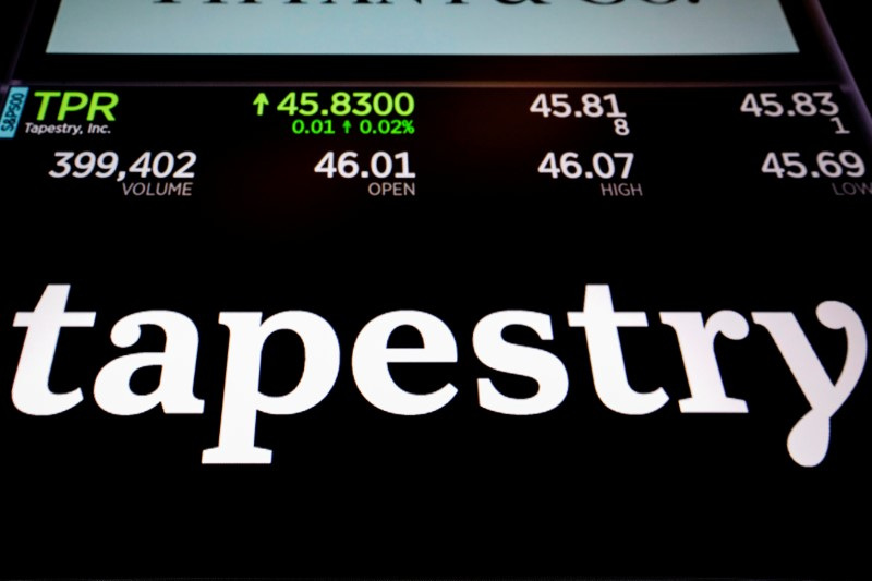 Tapestry Inc. logo and trading information are displayed on a screen on the floor of the NYSE in New York