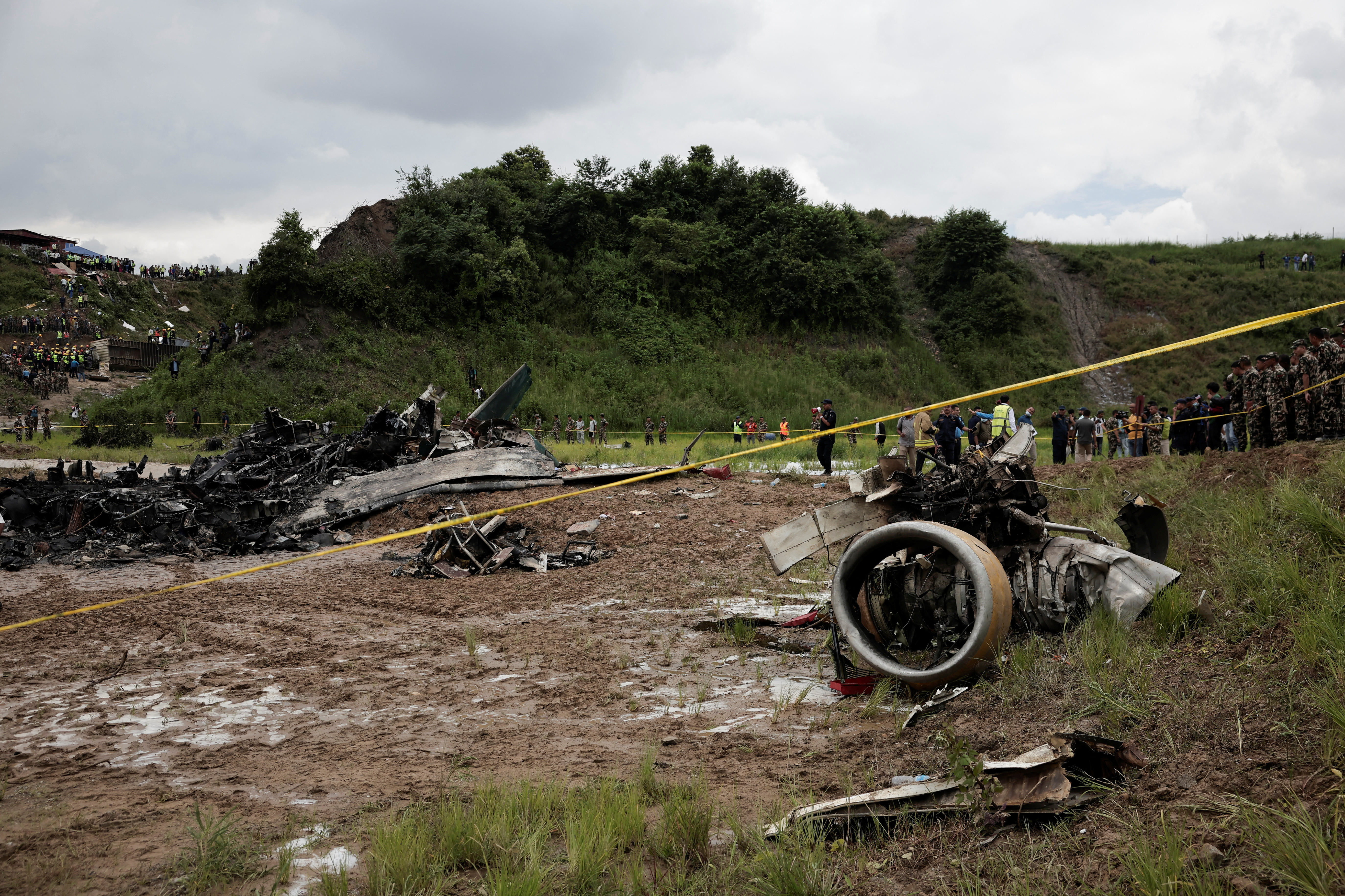 Burnt wreckage of crashed aircraft, in Kathmandu