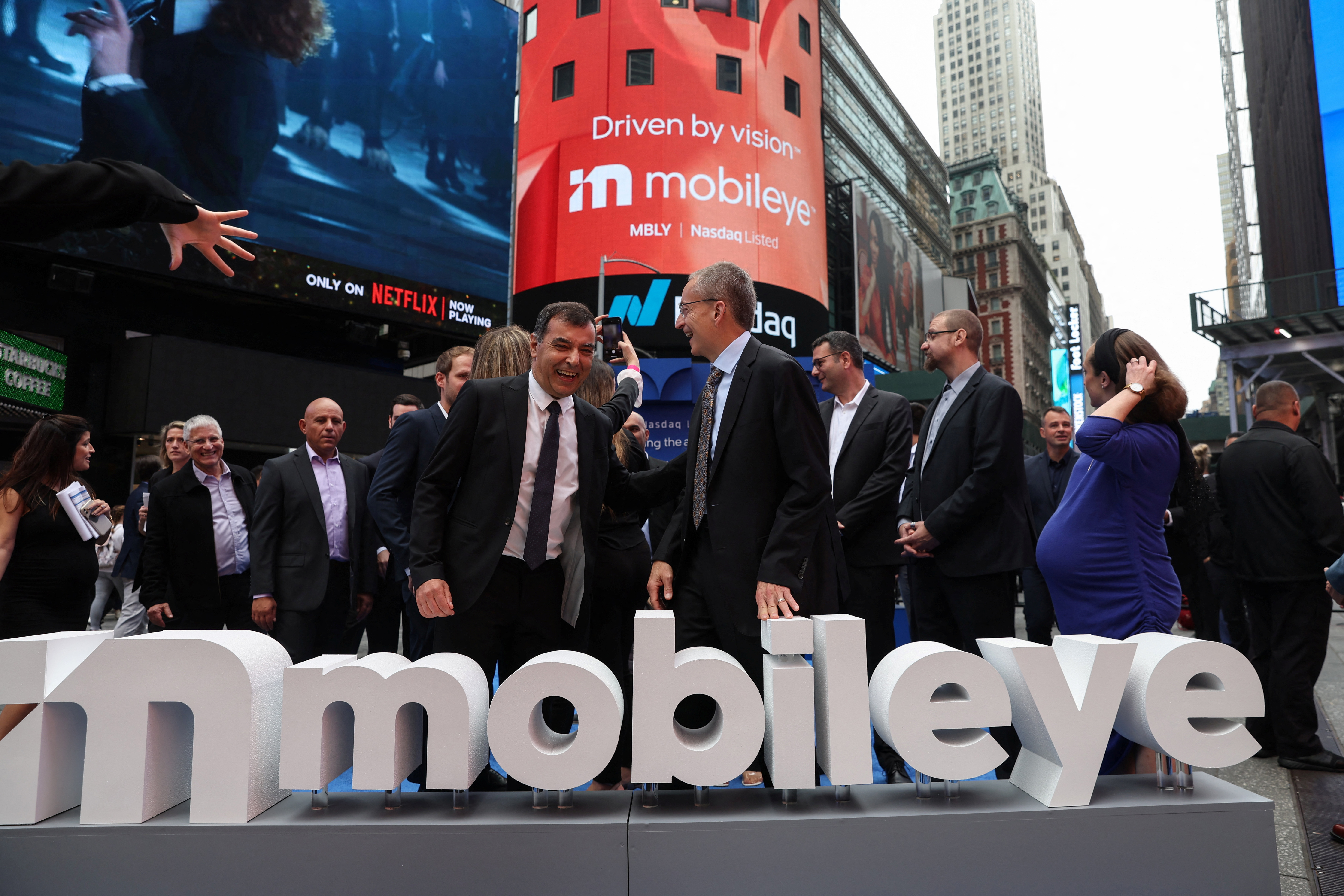 Professor Amnon Shashua and Pat Gelsinger celebrate after ringing the opening bell for Mobileye Global Inc., in New York City