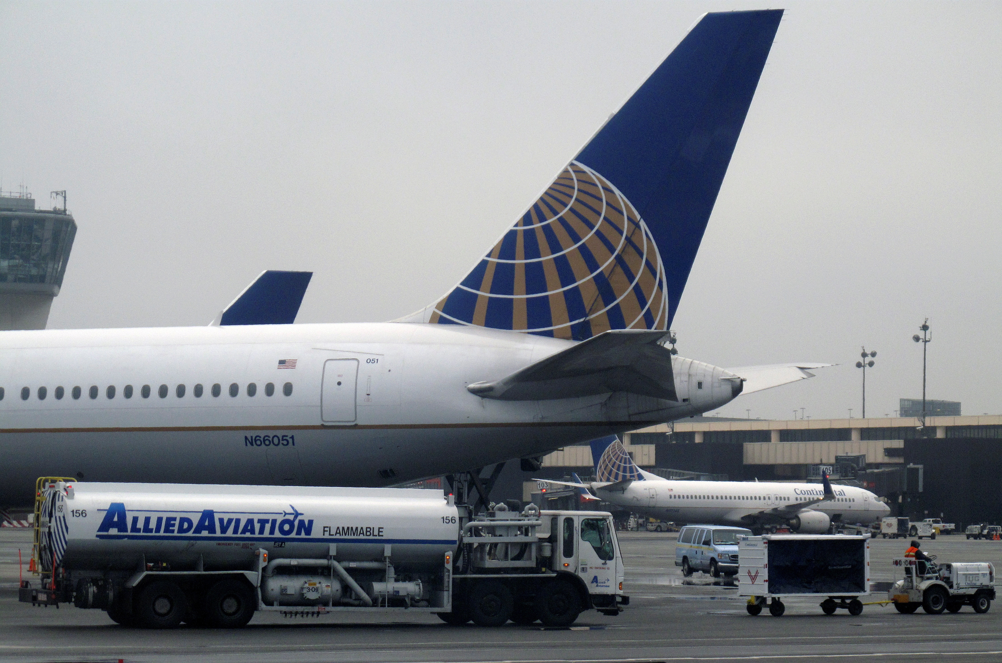 A Continental Airlines airplane is refueled at its gate at Newark Liberty International Airport in Newark, New Jersey