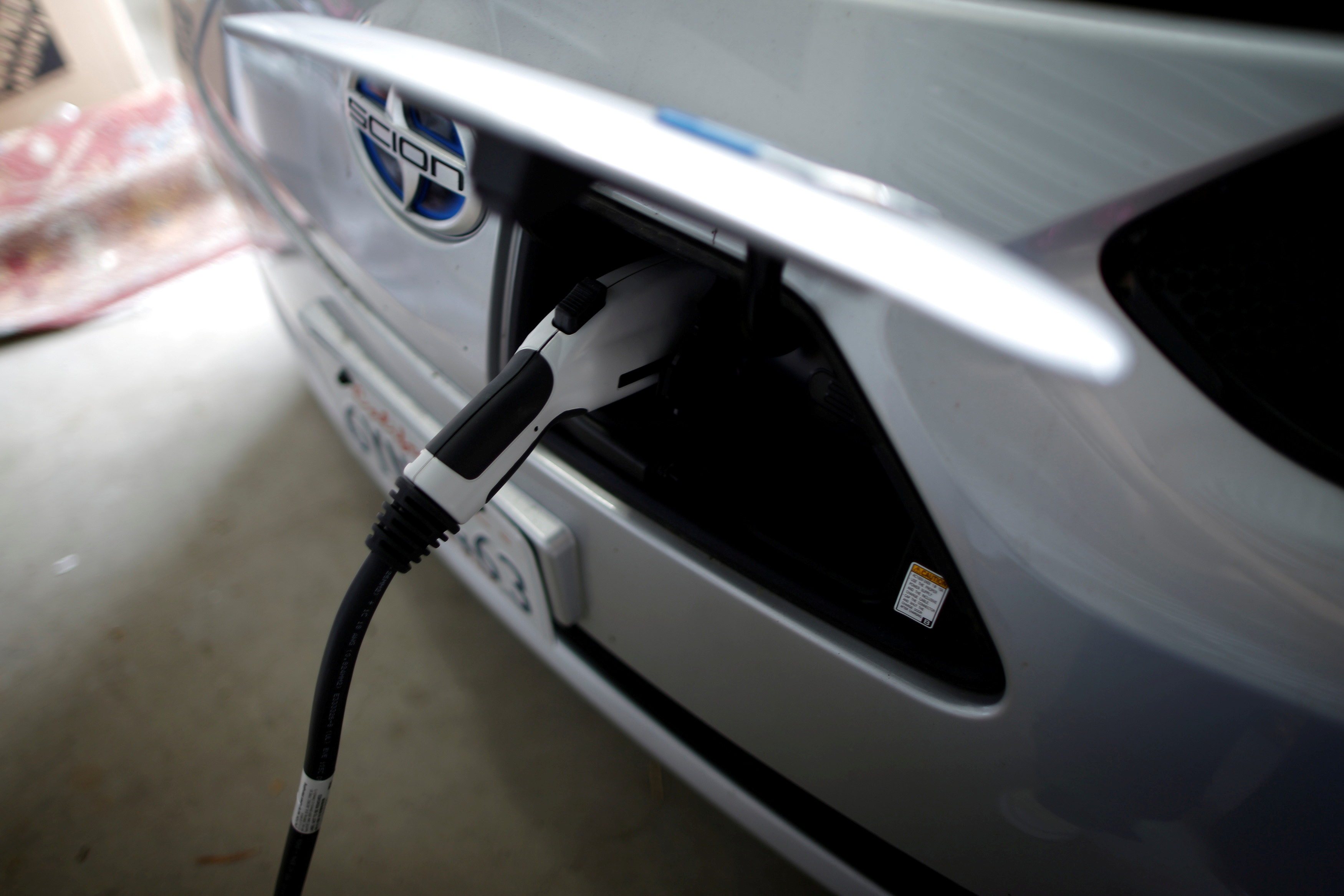 Computer science professor's electric car is plugged in in her garage in Irvine, California January 26, 2015. REUTERS/Lucy Nicholson