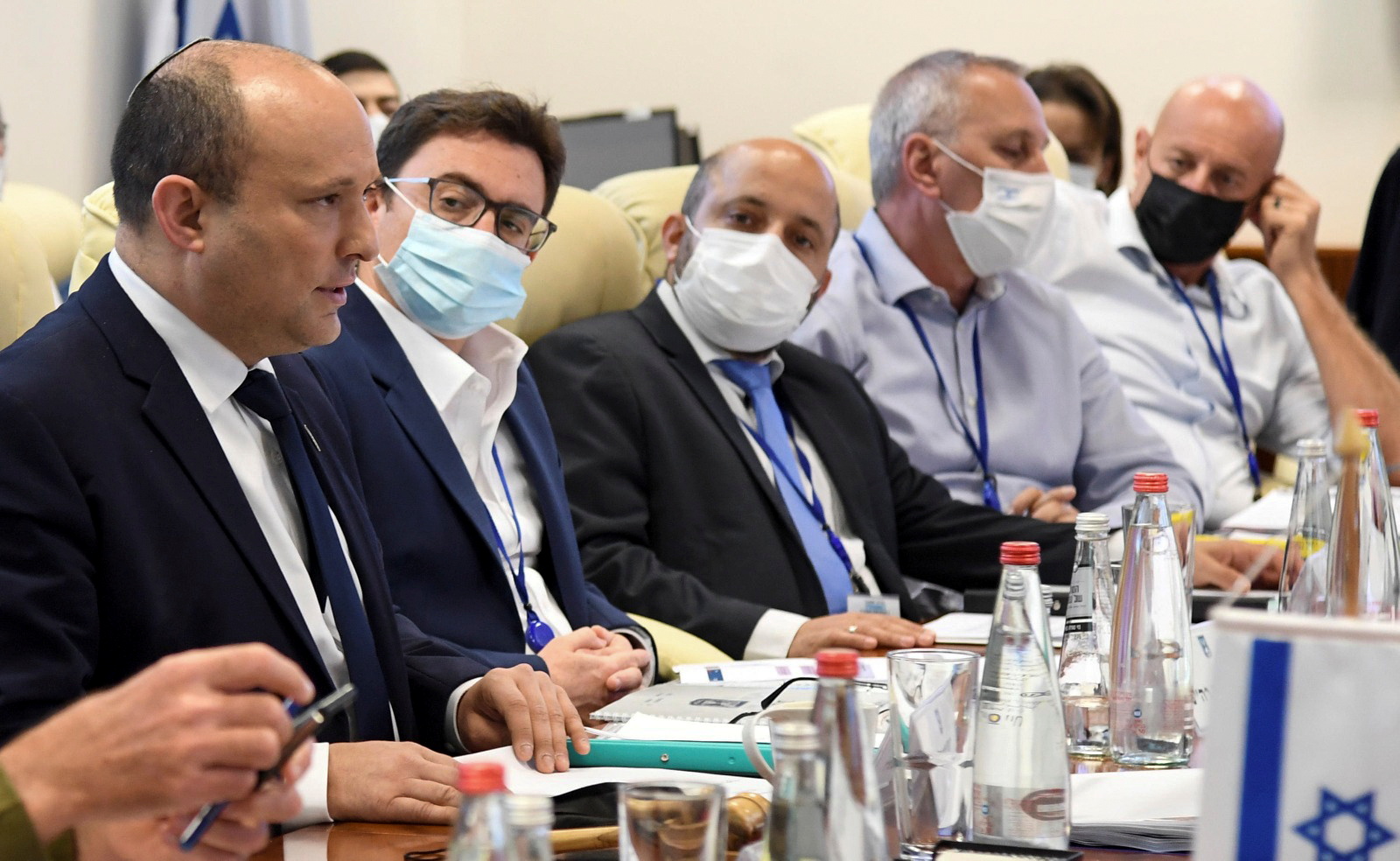 Prime Minister Naftali Bennett addresses senior aides in Israel’s nuclear bunker during a drill simulating an outbreak of a vaccine-resistant coronavirus disease (COVID-19) strain in Tel Aviv