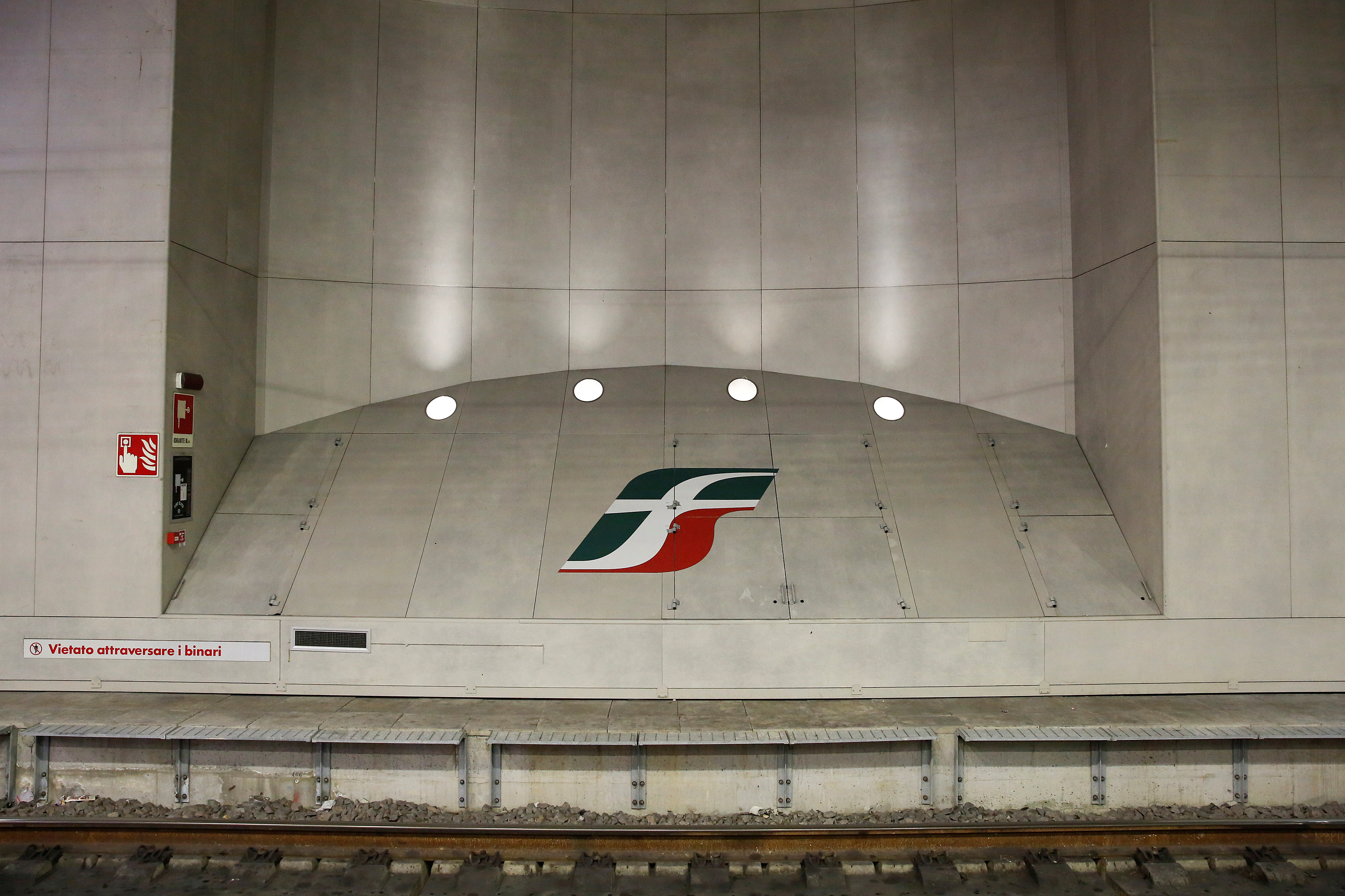 An Italian railway group Ferrovie dello Stato logo is seen at the Bologna Central Station