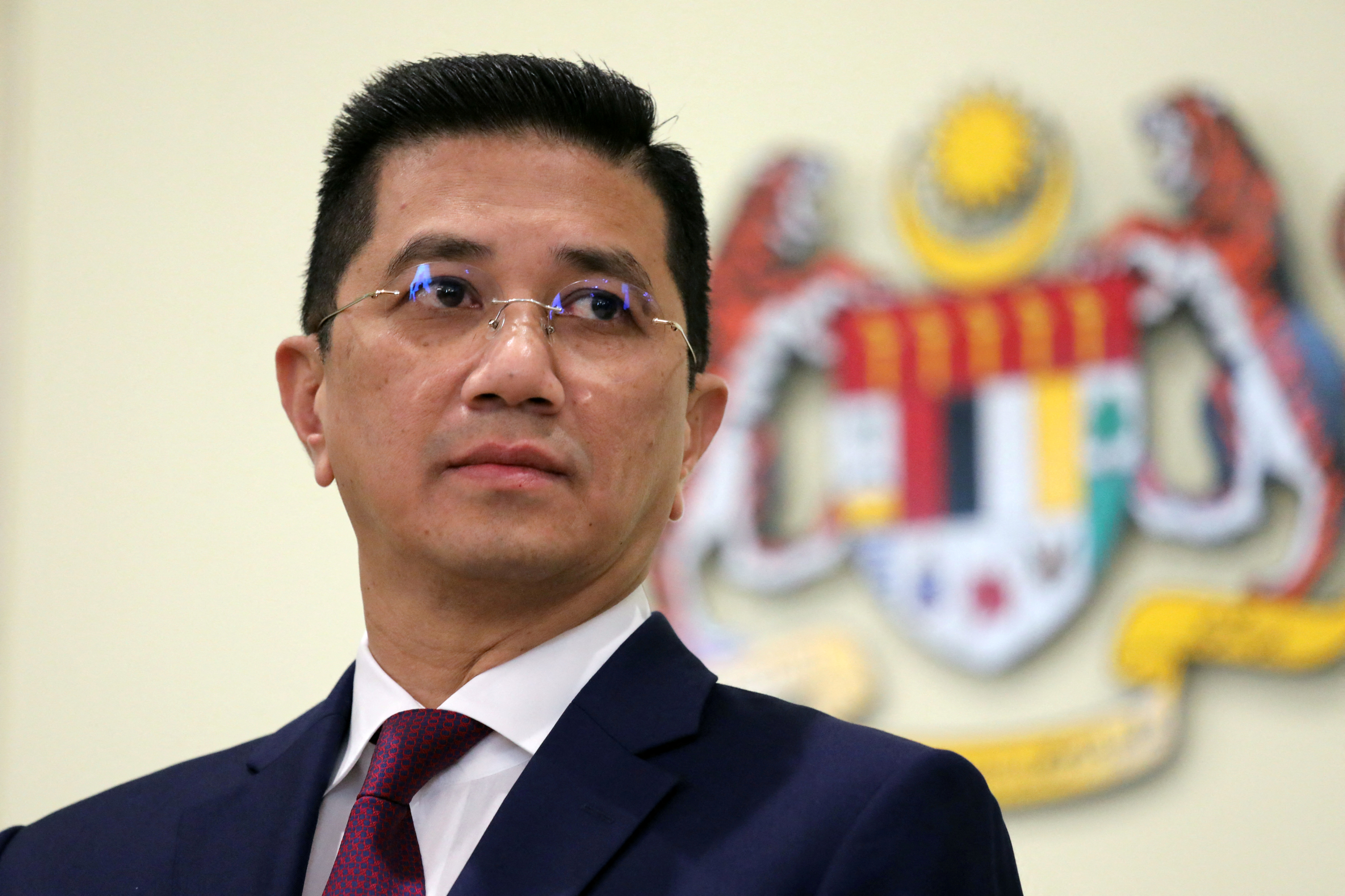 Malaysia's Minister of International Trade and Industry Azmin Ali reacts during a news conference in Putrajaya