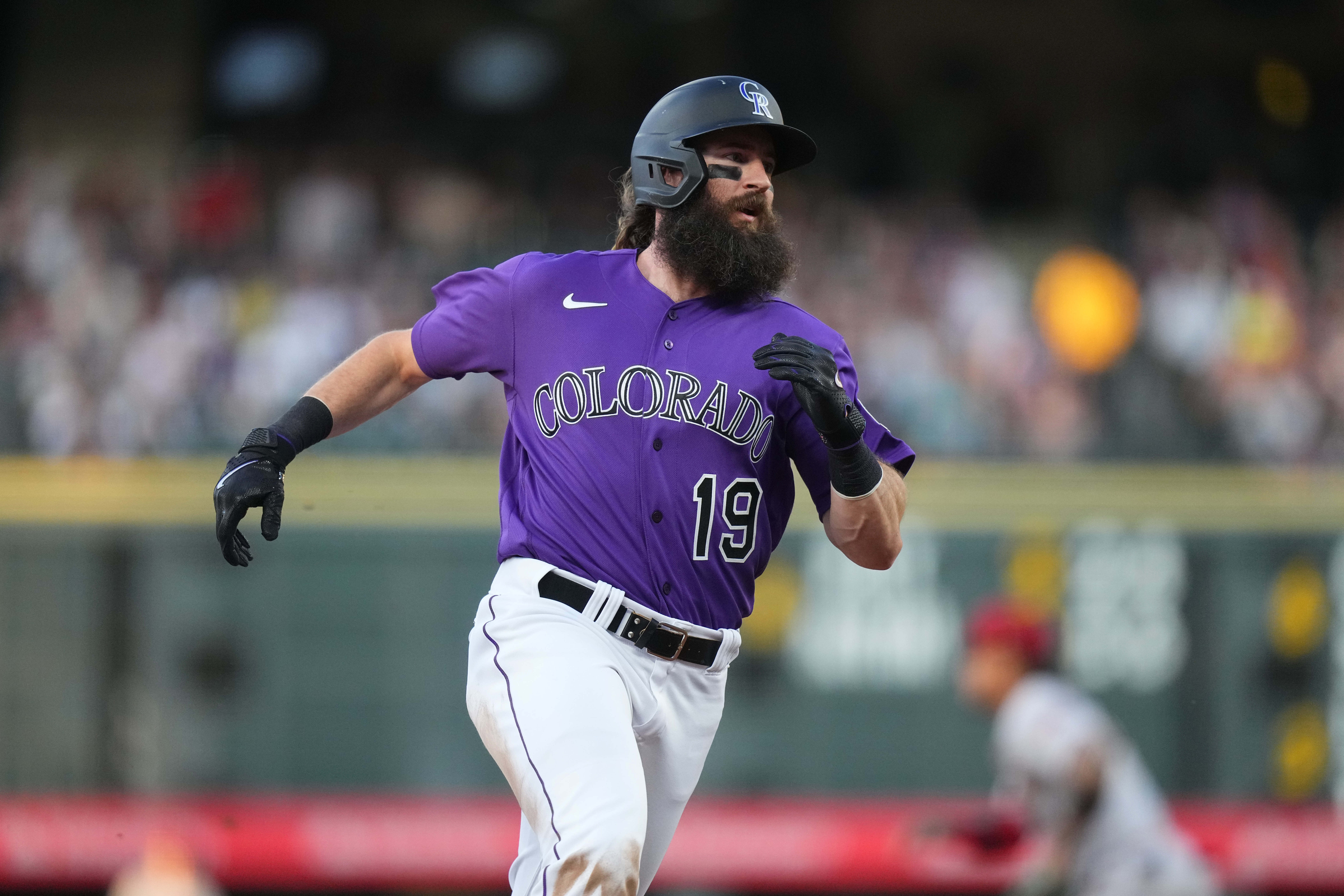 DENVER, CO - JUNE 14: Colorado Rockies right fielder Charlie Blackmon (19)  advances to third base in the tenth inning during a game between the  Cleveland Guardians and the Colorado Rockies at