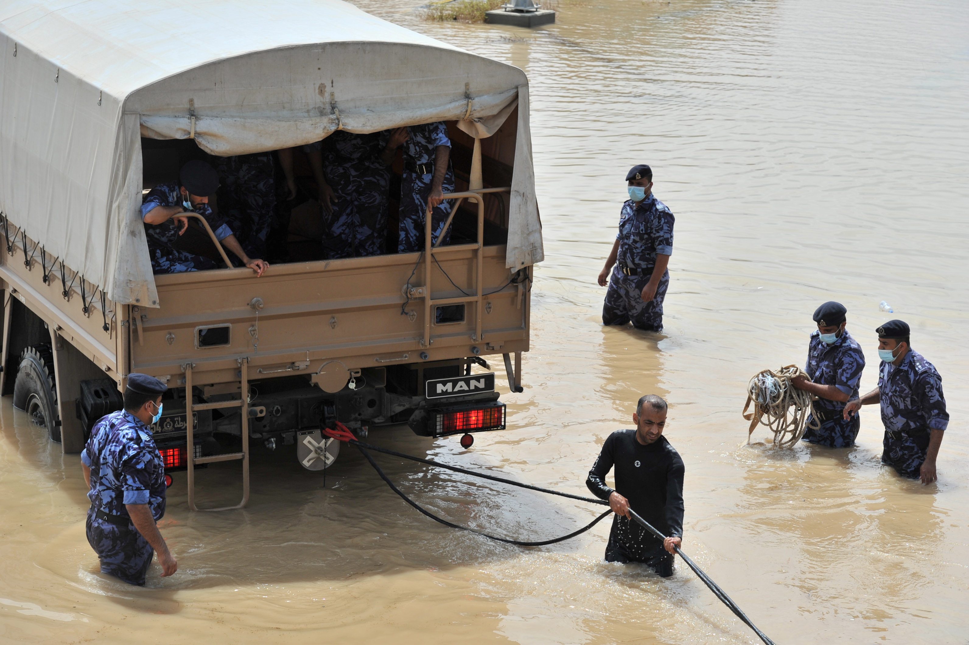 Oman Military officials repair damages caused by Cyclone Shaheen in Al Musanaa