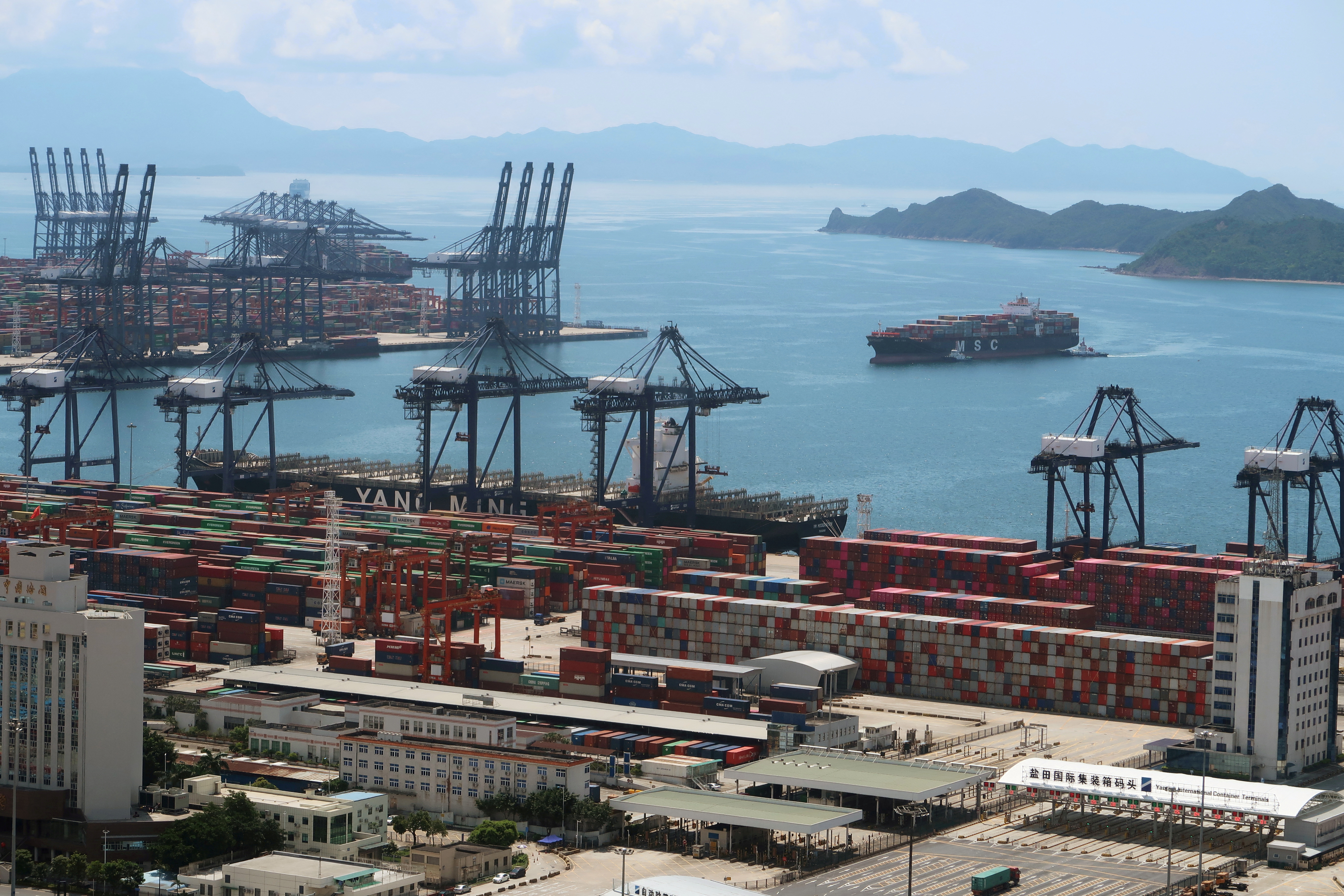FILE PHOTO: Cargo ship carrying containers is seen near the Yantian port in Shenzhen, following the novel coronavirus disease (COVID-19) outbreak, Guangdong