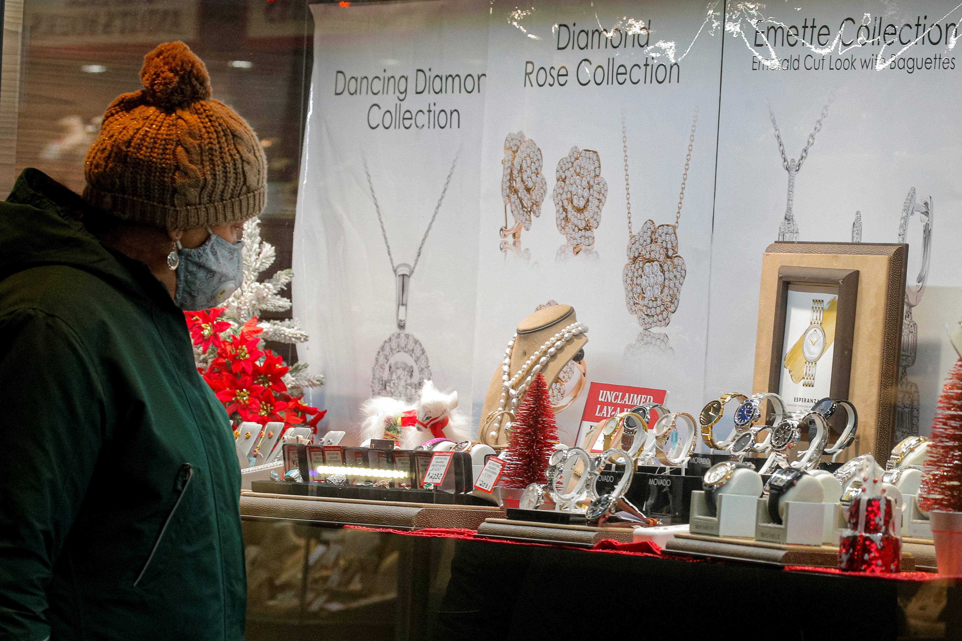 A shopper looks at jewelry in a store window in Brooklyn, New York