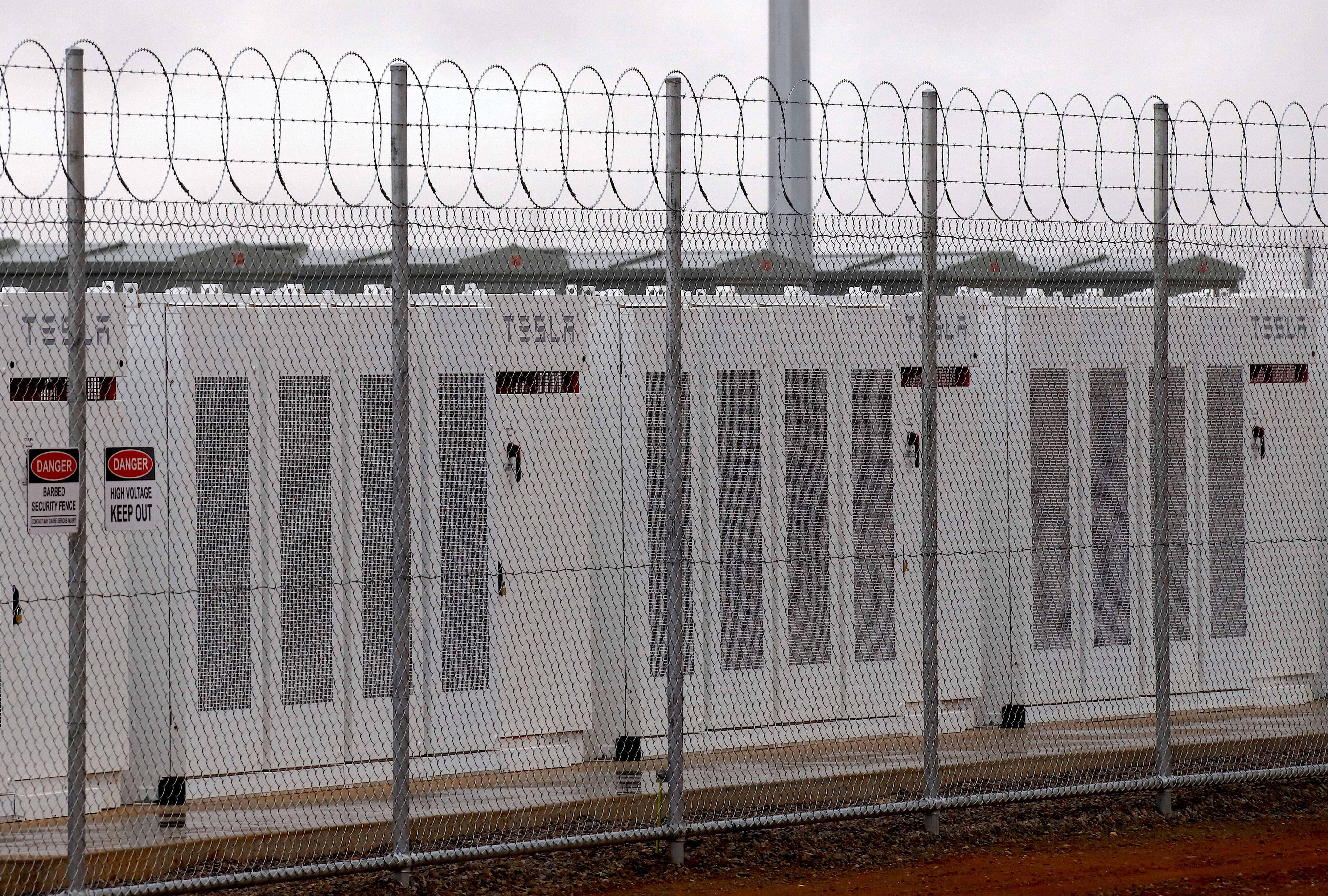 A fence surrounds the Hornsdale Power Reserve, featuring a lithium-ion battery made by Tesla, near the South Australian town of Jamestown