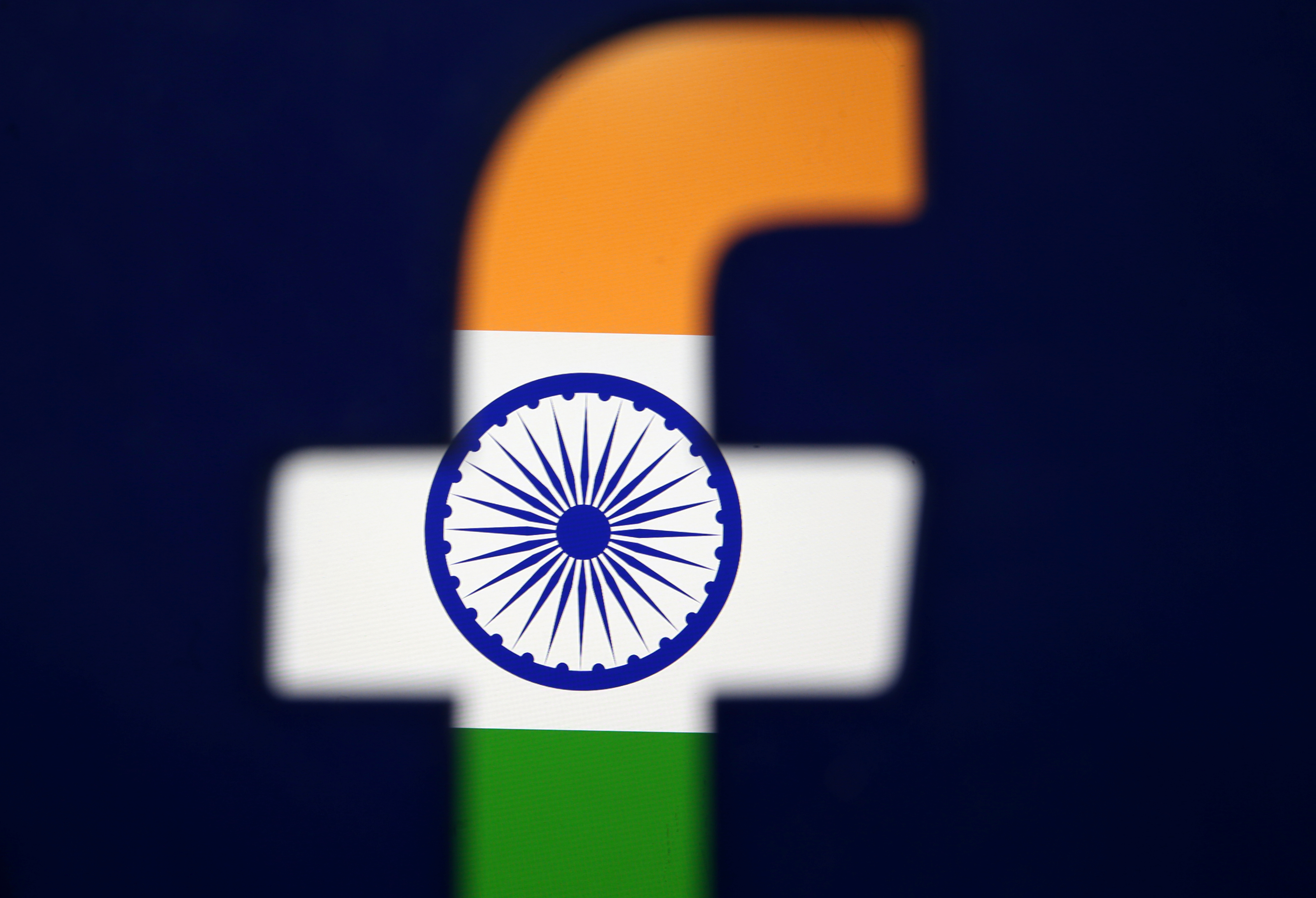 India's flag is seen through a 3D printed Facebook logo in this illustration picture