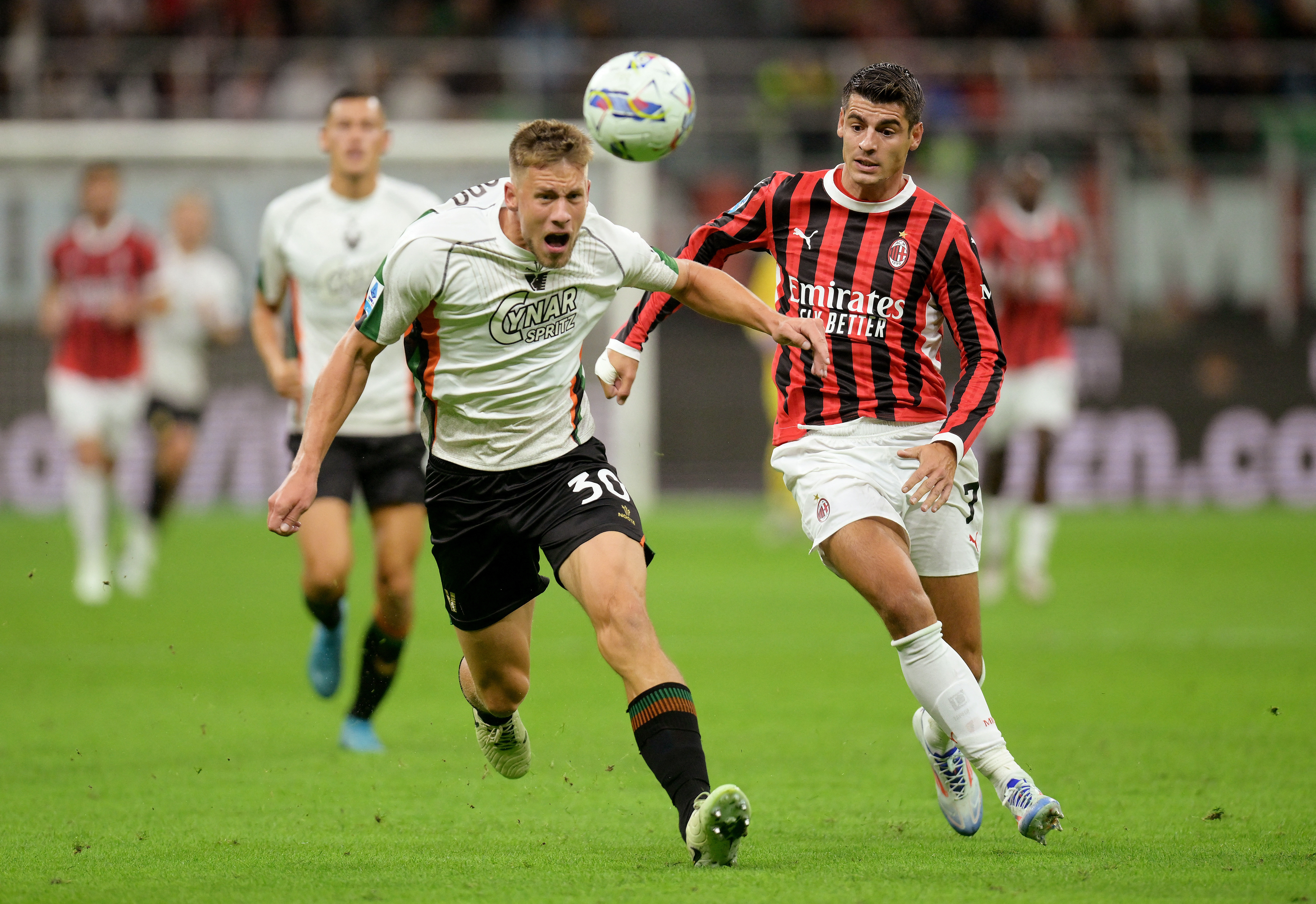 Soccer Football - Serie A - AC Milan v Venezia - San Siro, Milan, Italy - September 14, 2024 AC Milan's Alvaro Morata in action with Venezia's Michael Svoboda REUTERS/Daniele Mascolo 