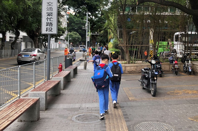 Children leave a school in the Shekou area of Shenzhen