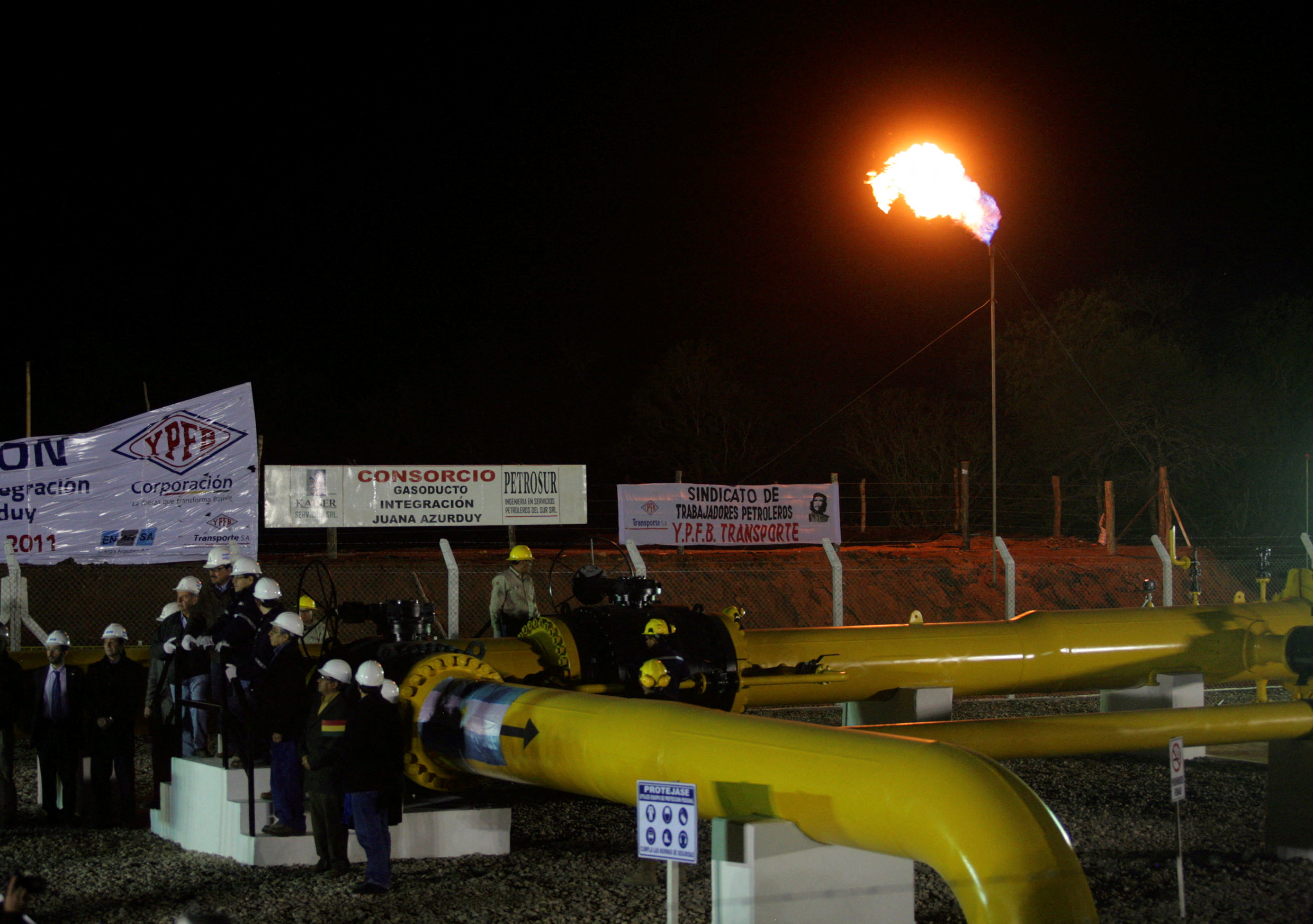 Workers attend the inauguration of a newly opened gas pipeline, between Bolivia and Argentina, in Yacuiba