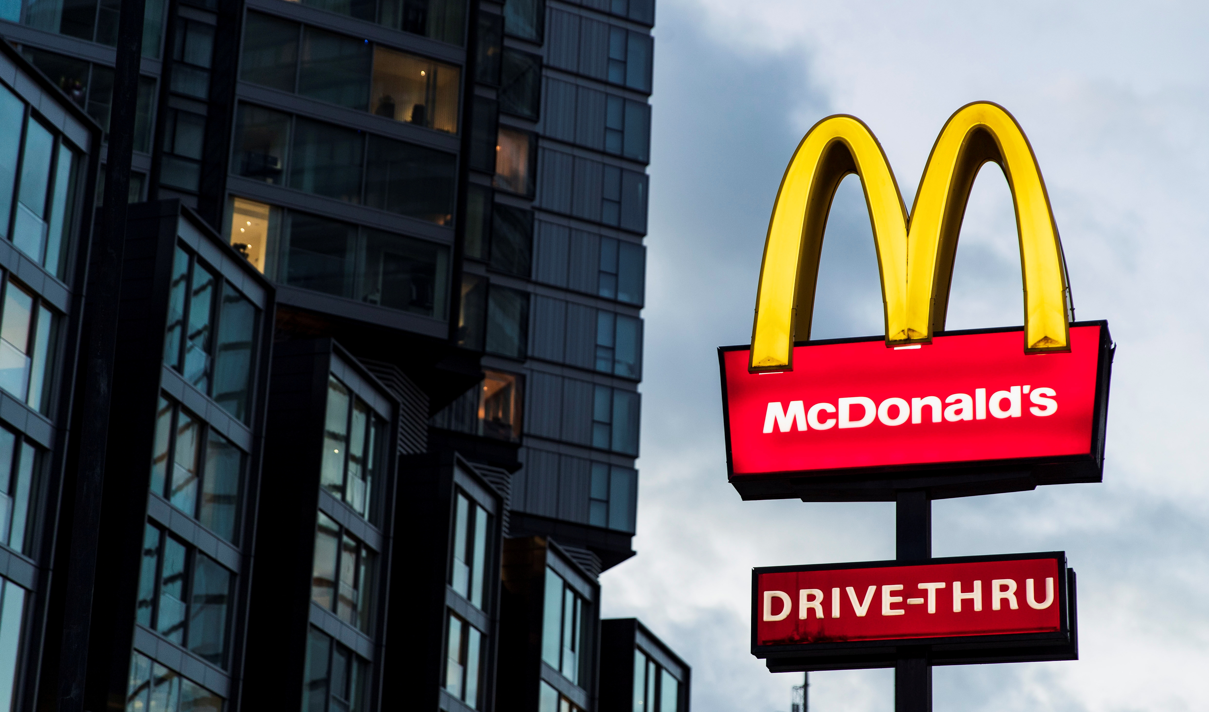 A view of a sign outside a McDonald's drive-thru restaurant in London