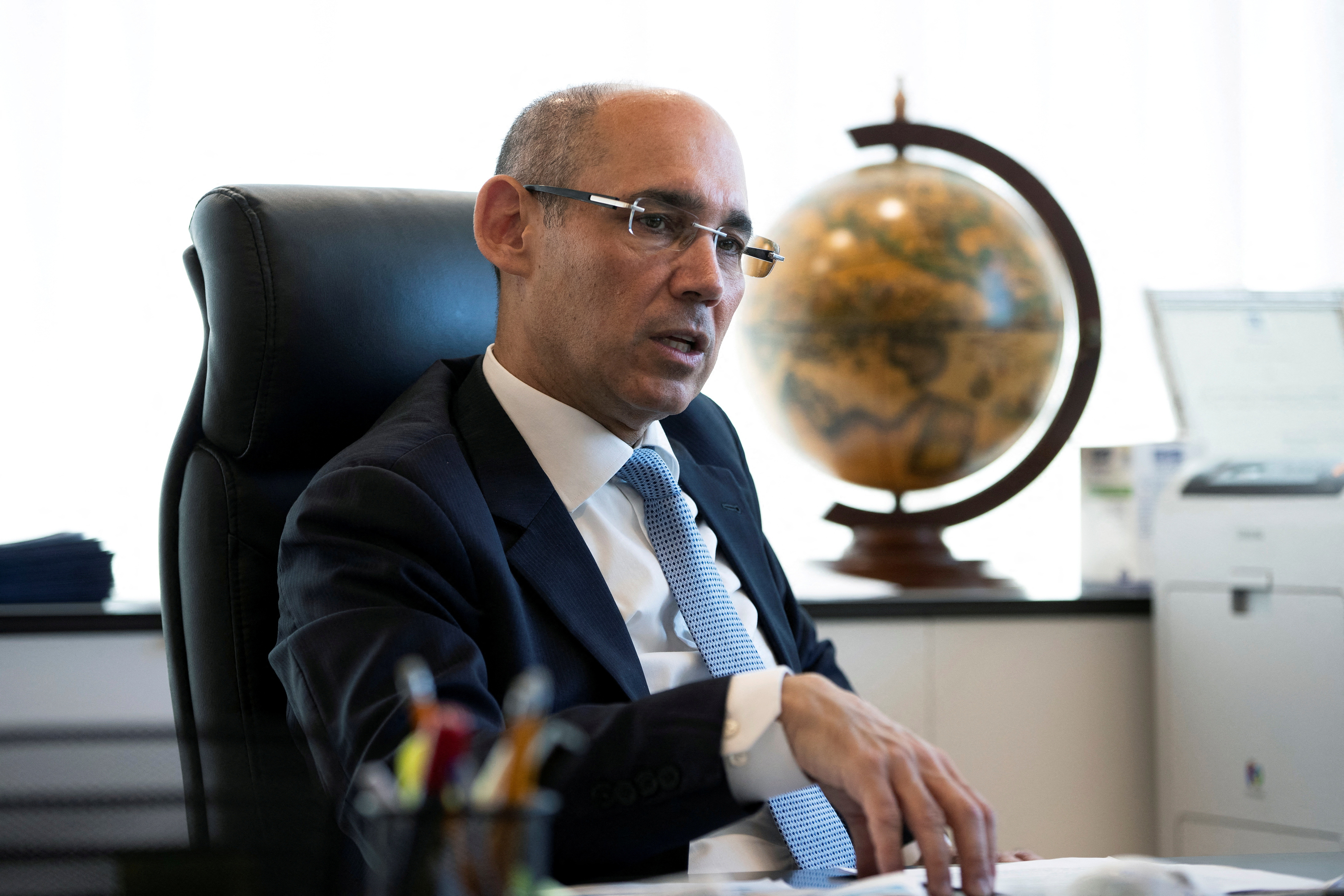 Bank of Israel Governor Amir Yaron gestures while he speaks during his interview with Reuters in Jerusalem