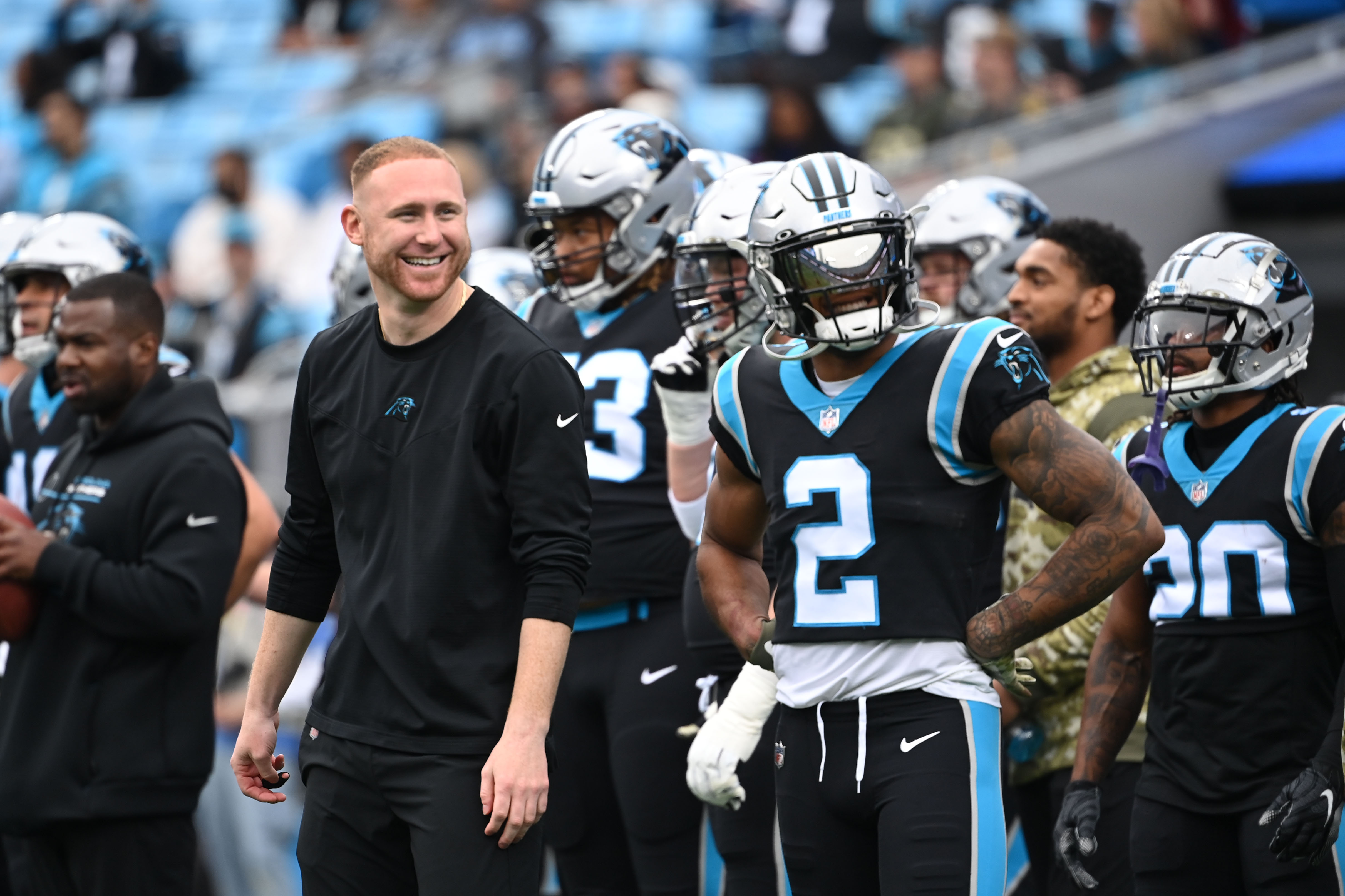 Nov 21, 2021; Charlotte, North Carolina, USA;  Carolina Panthers assistant coach Joe Brady and wide receiver D.J. Moore (2) on the field before the game at Bank of America Stadium. Mandatory Credit: Bob Donnan-USA TODAY Sports