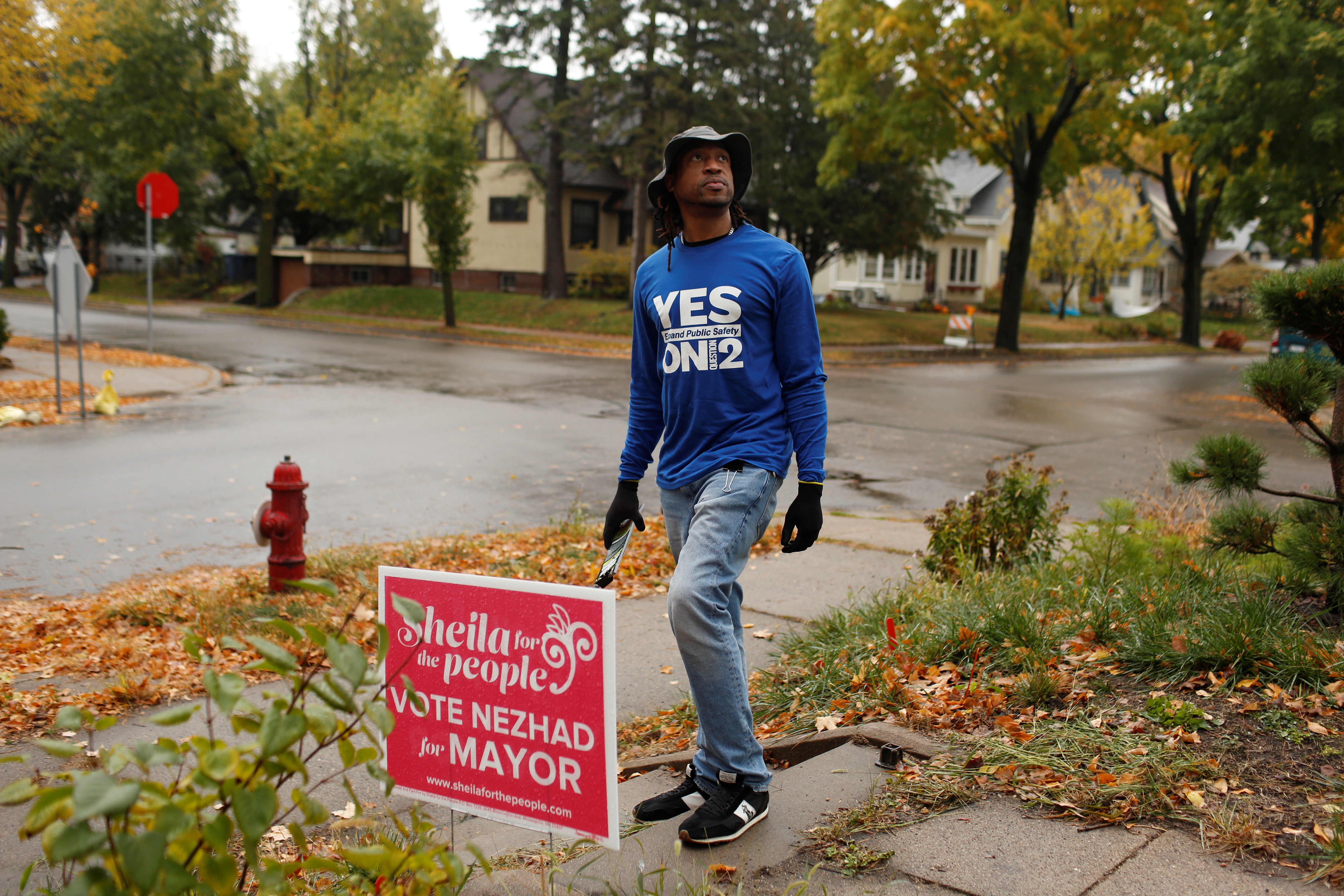 Frank McCrary III canvasses to encourage voters ahead of the November 2nd vote on the future of the police department in Minneapolis, Minnesota, U.S., October 28, 2021. Picture taken October 28, 2021.  REUTERS/Nicole Neri