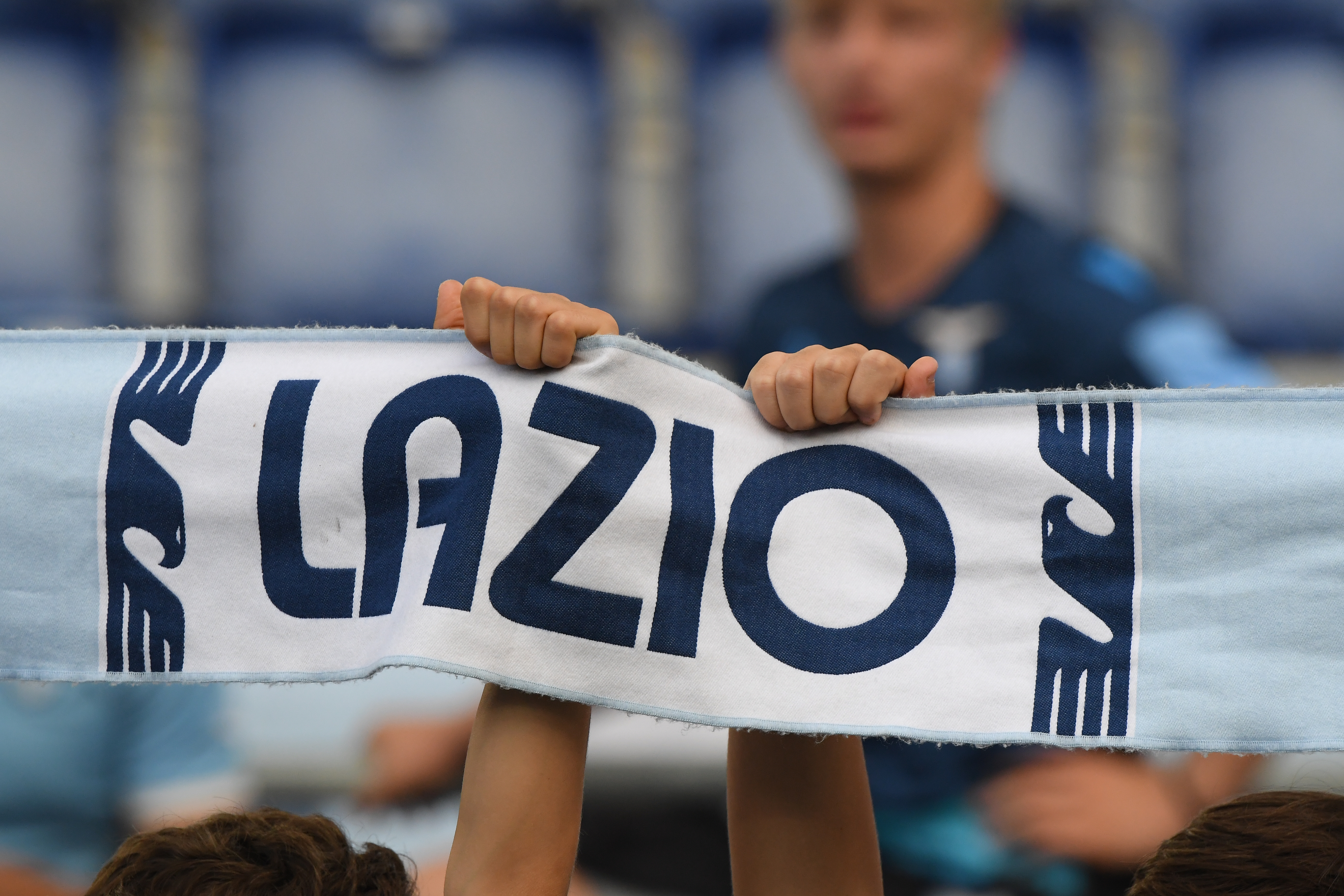 Soccer Football - Serie A - Lazio v Cagliari - Stadio Olimpico, Rome, Italy - September 19, 2021 General view of Lazio fans holding a scarf inside the stadium before the match REUTERS/Alberto Lingria