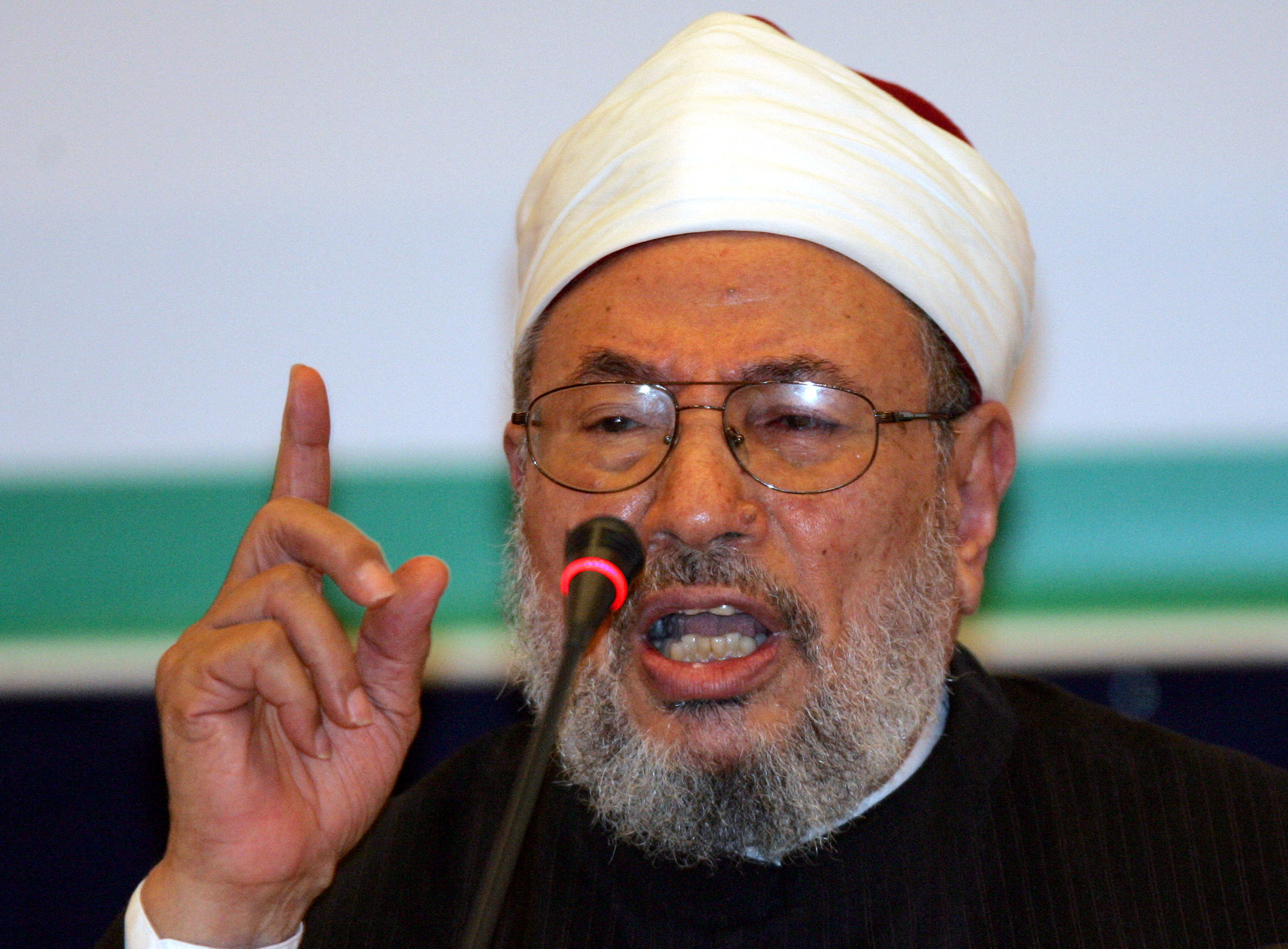 Qatar's influential cleric Al-Qaradawi attends opening session of conference in Doha