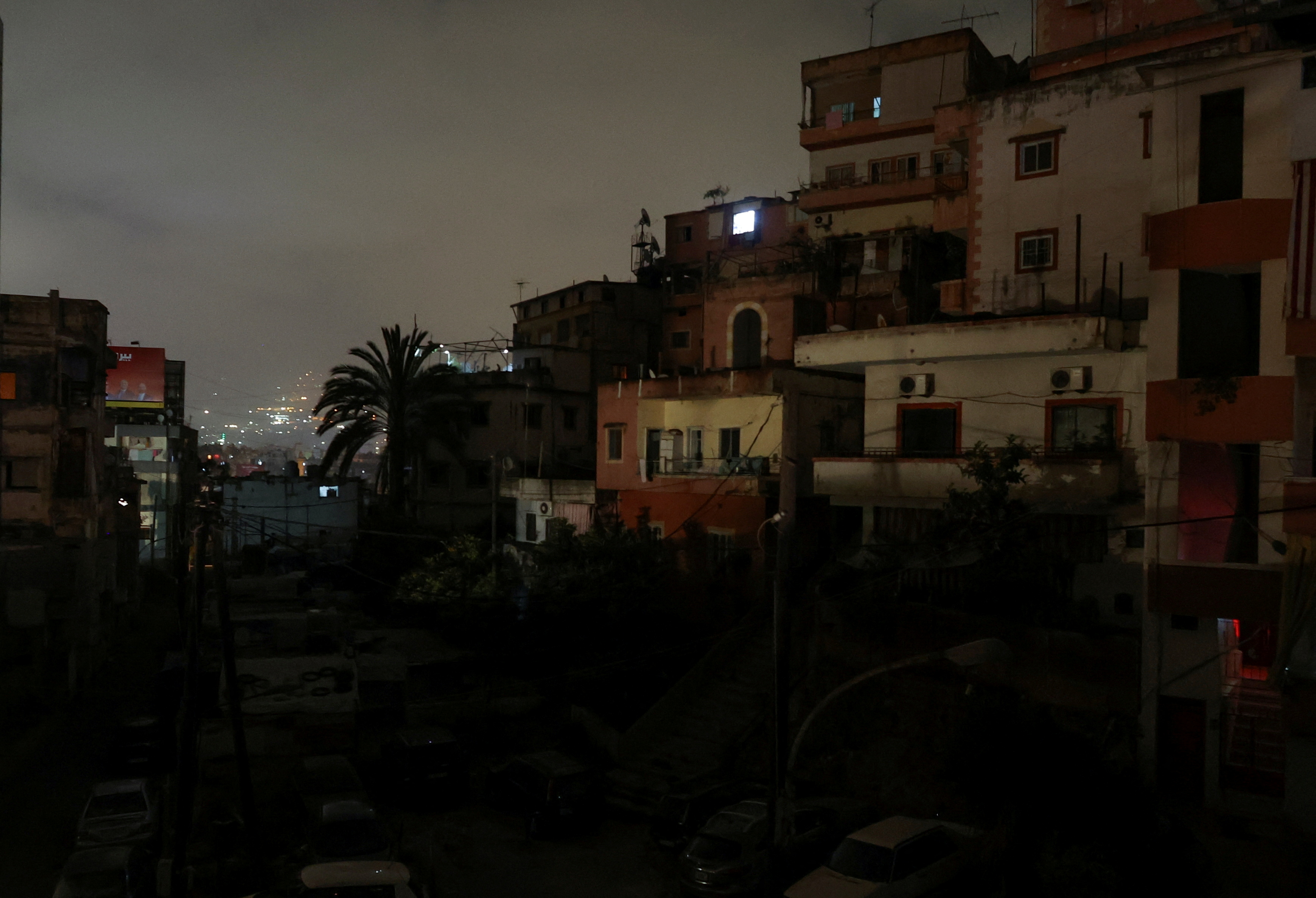 Residential buildings are pictured at night during a power cut in Beirut