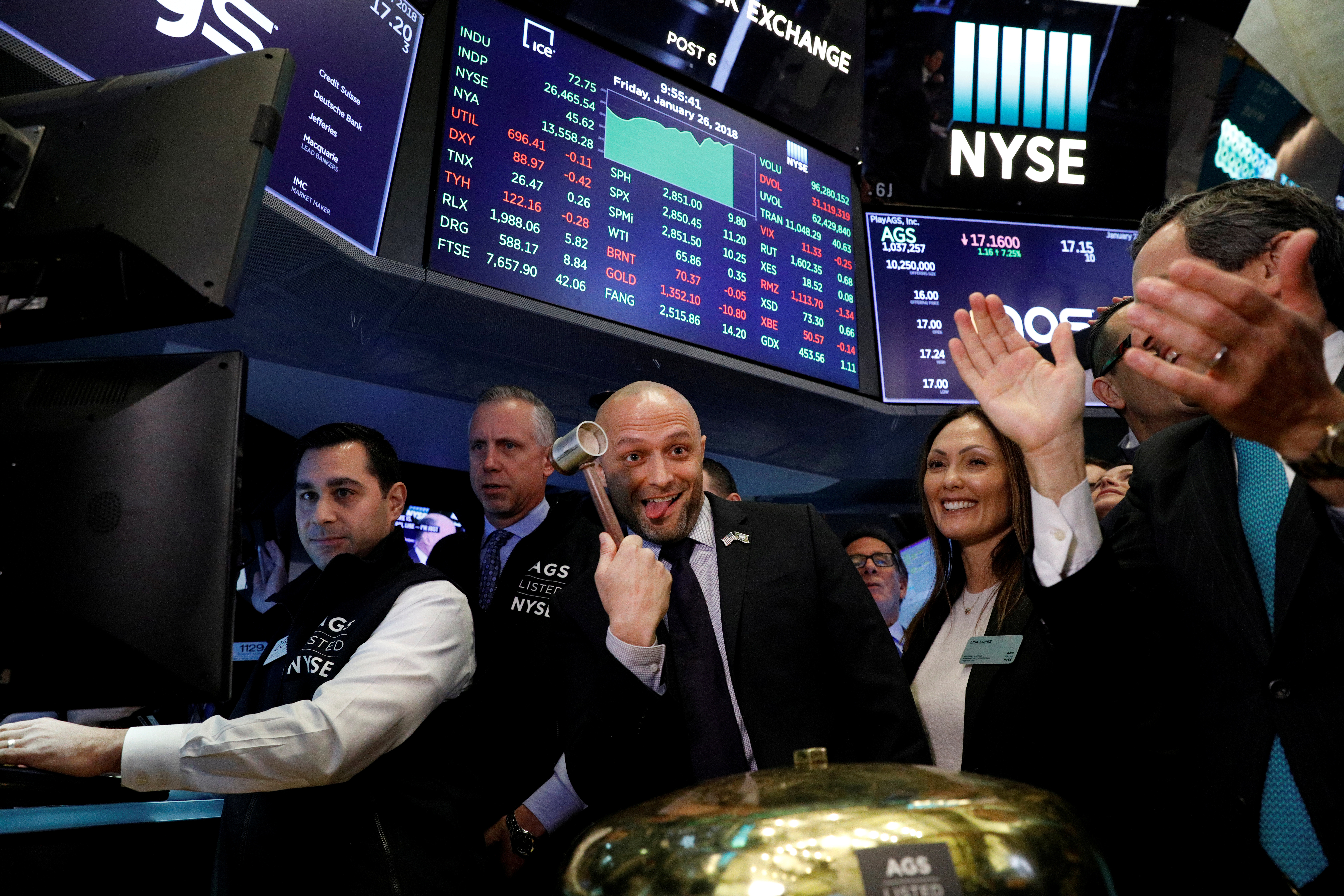 PlayAGS, Inc.'s President and CEO David Lopez celebrates his company's IPO on the floor of the New York Stock Exchange in New York