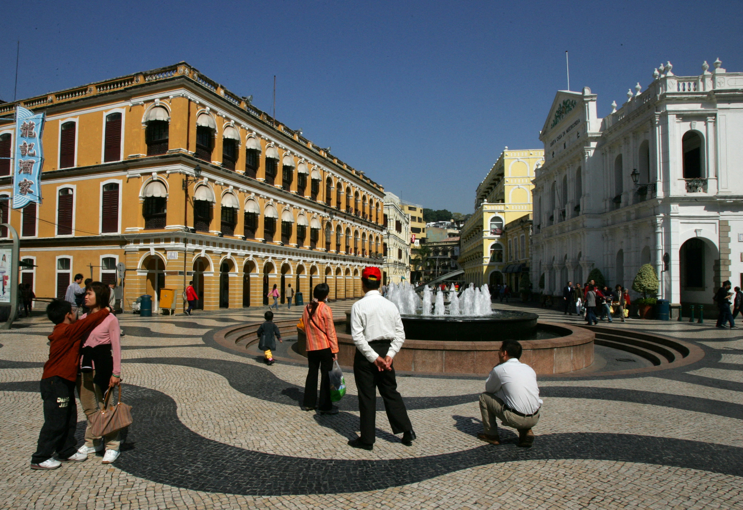 Mainland Chinese tourists visit Portuguese style buildings in Macau.