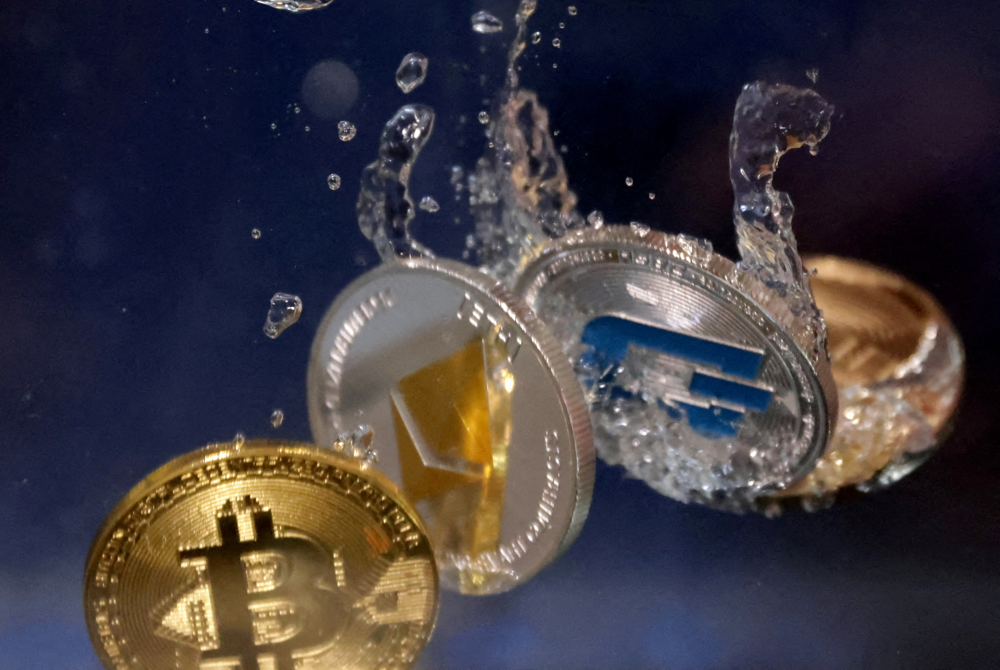 cryptocurrency Bitcoin, Ethereum and Dash plunging into water