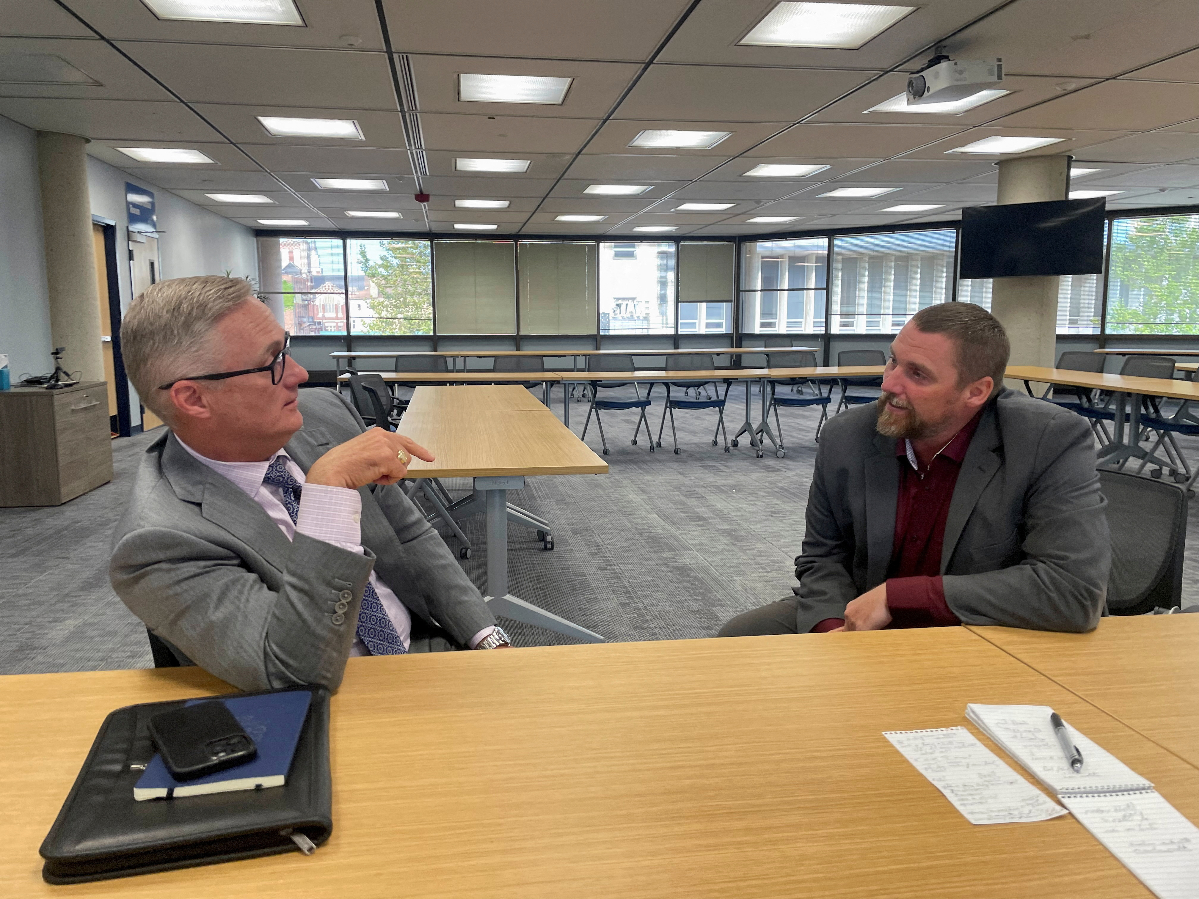 Springfield mayor Rob Rue talks with city manager Bryan Heck in Springfield