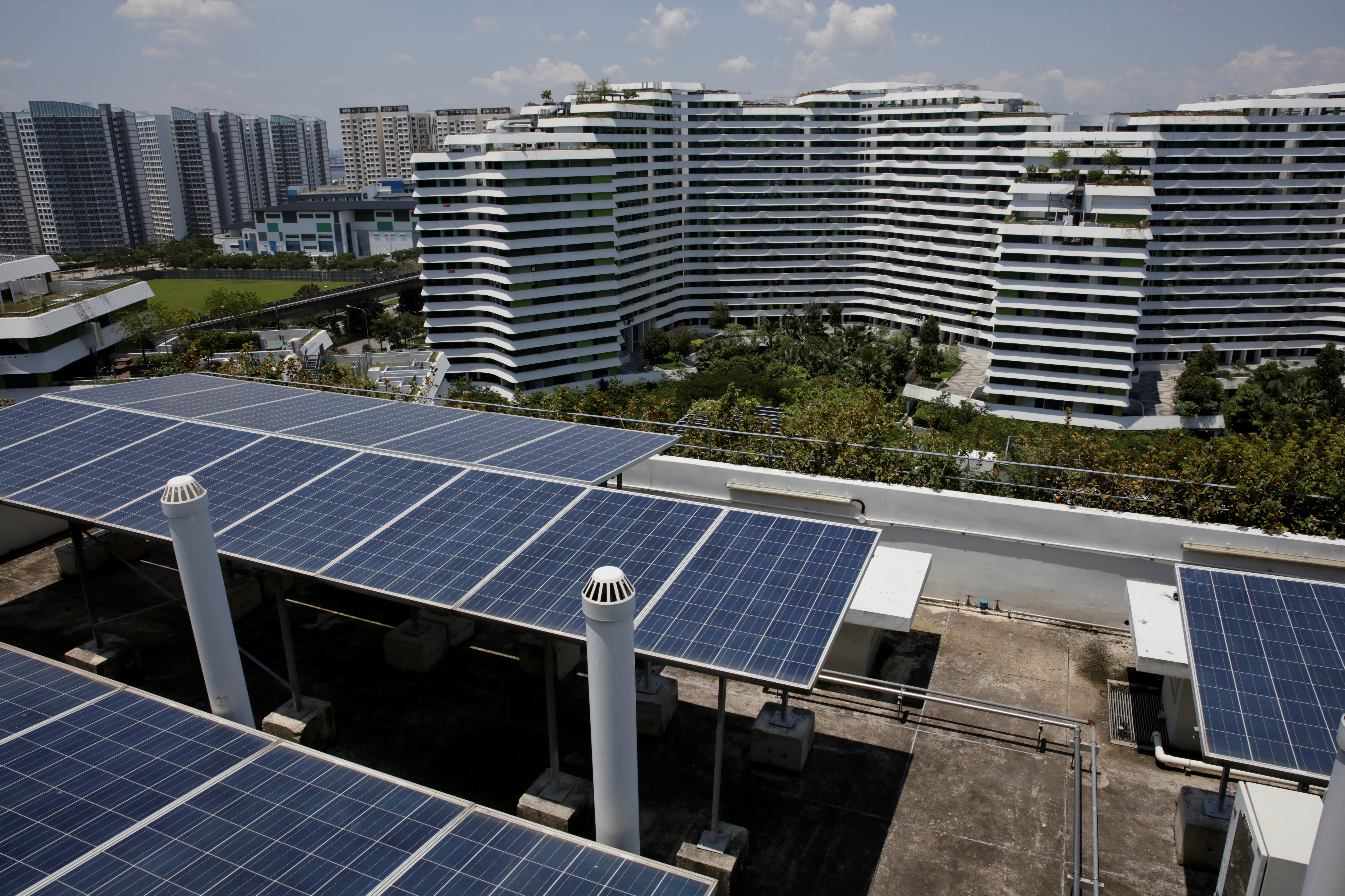 Solar panels are seen on the roof of a public housing block in Singapore