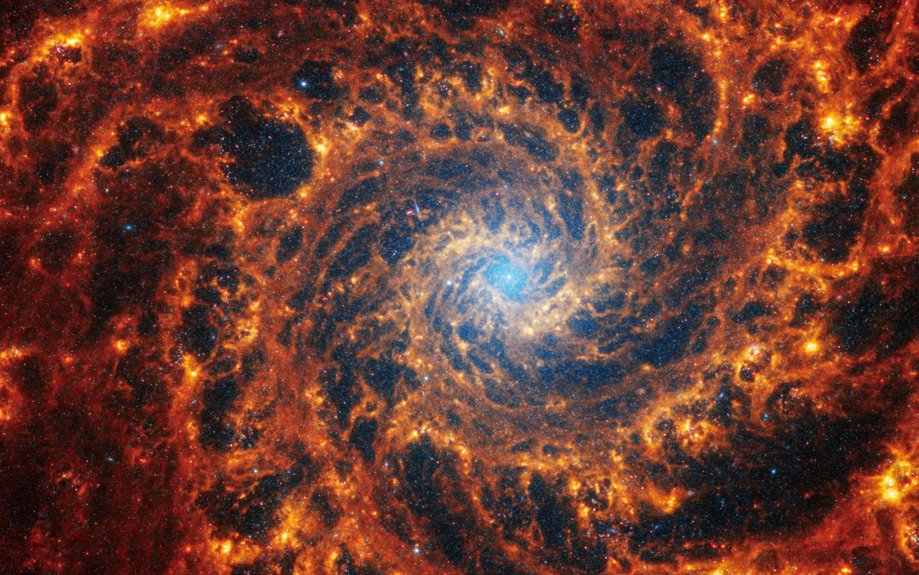 Spiral galaxy NGC 628, located 32 million light-years away from Earth, is seen in an image from the James Webb Space Telescope