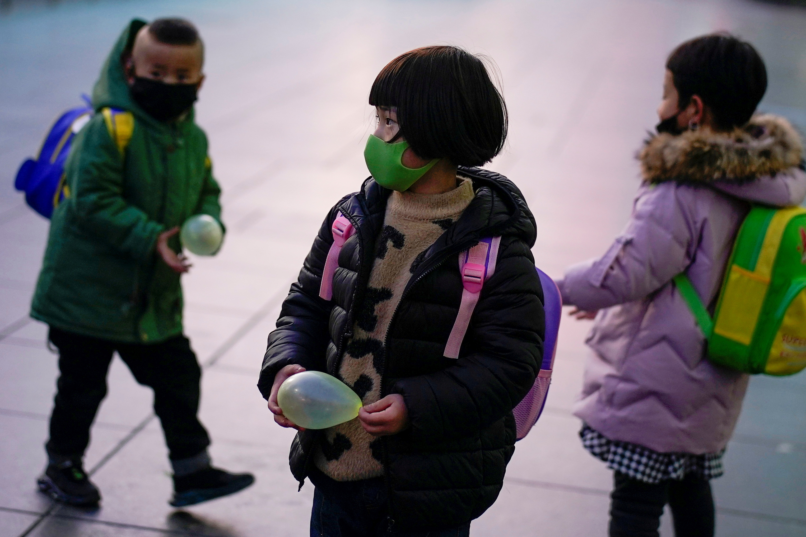 Children wearing face masks are seen at Shanghai railway station as the country is hit by an outbreak of the novel coronavirus, in Shanghai