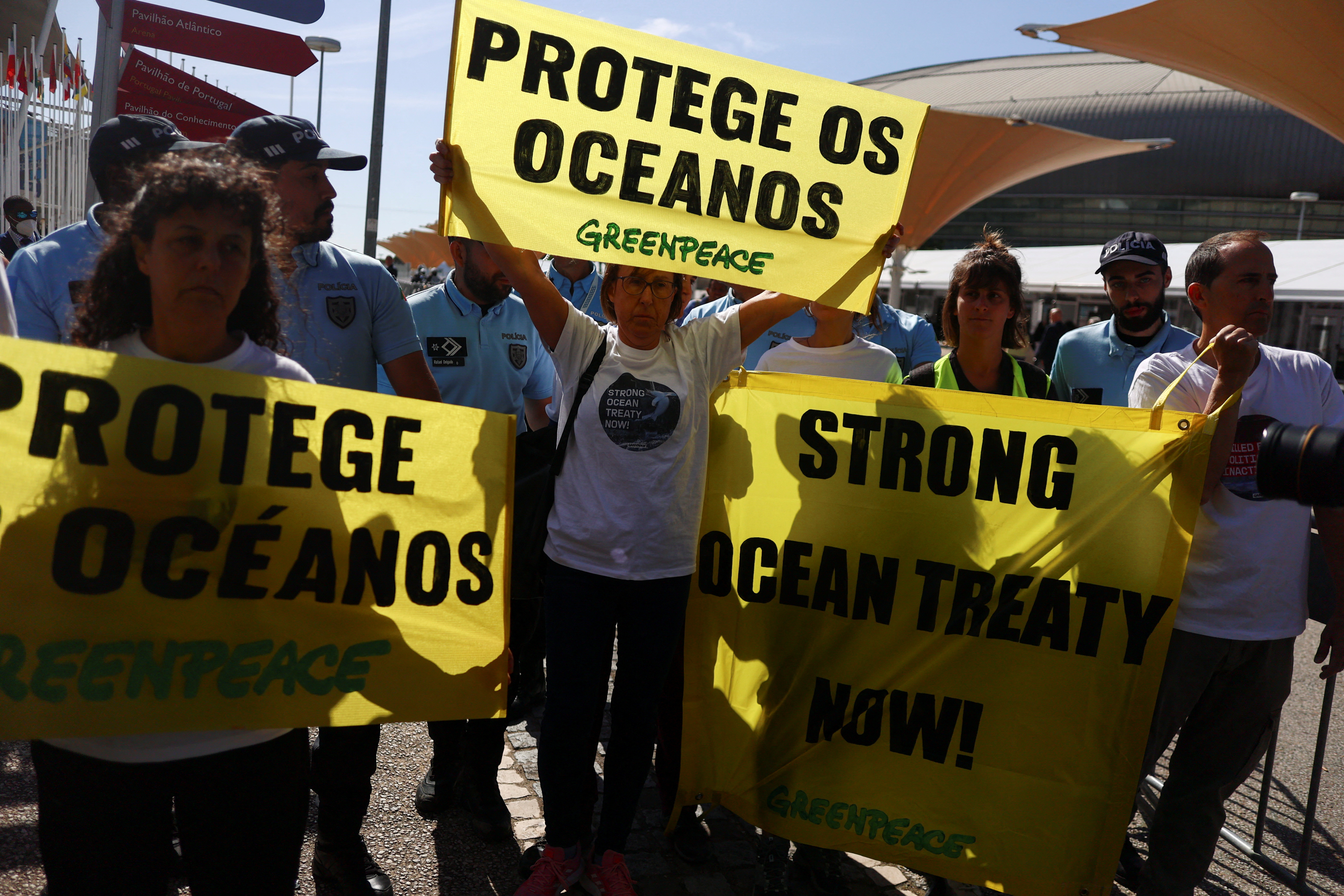 Greenpeace activists demonstrate outside the U.N. Ocean Conference in Lisbon