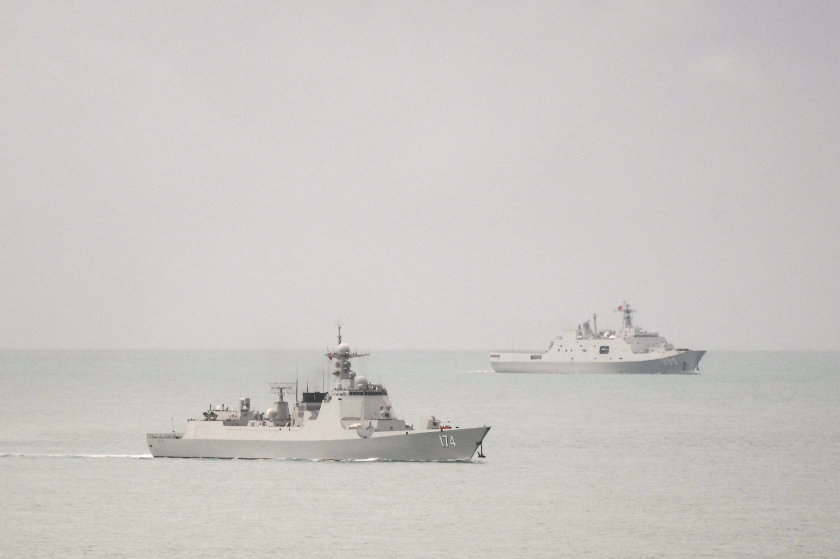 A PLA-N Luyang-class guided missile destroyer and a PLA-N Yuzhao-class amphibious transport dock vessel leave the Torres Strait and enter the Coral Sea