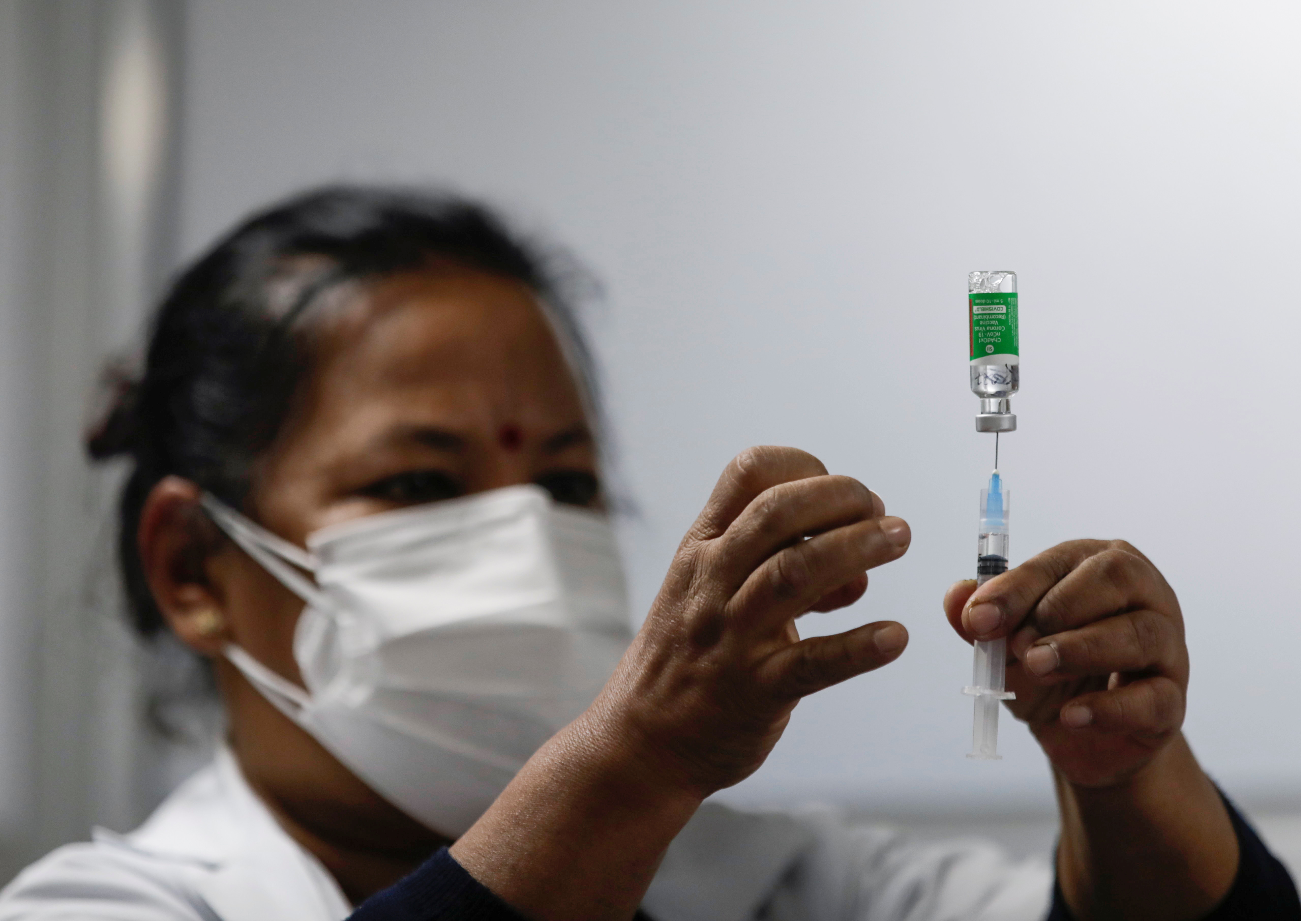 Nepal kicks off coronavirus inoculations with Indian vaccine | Reuters