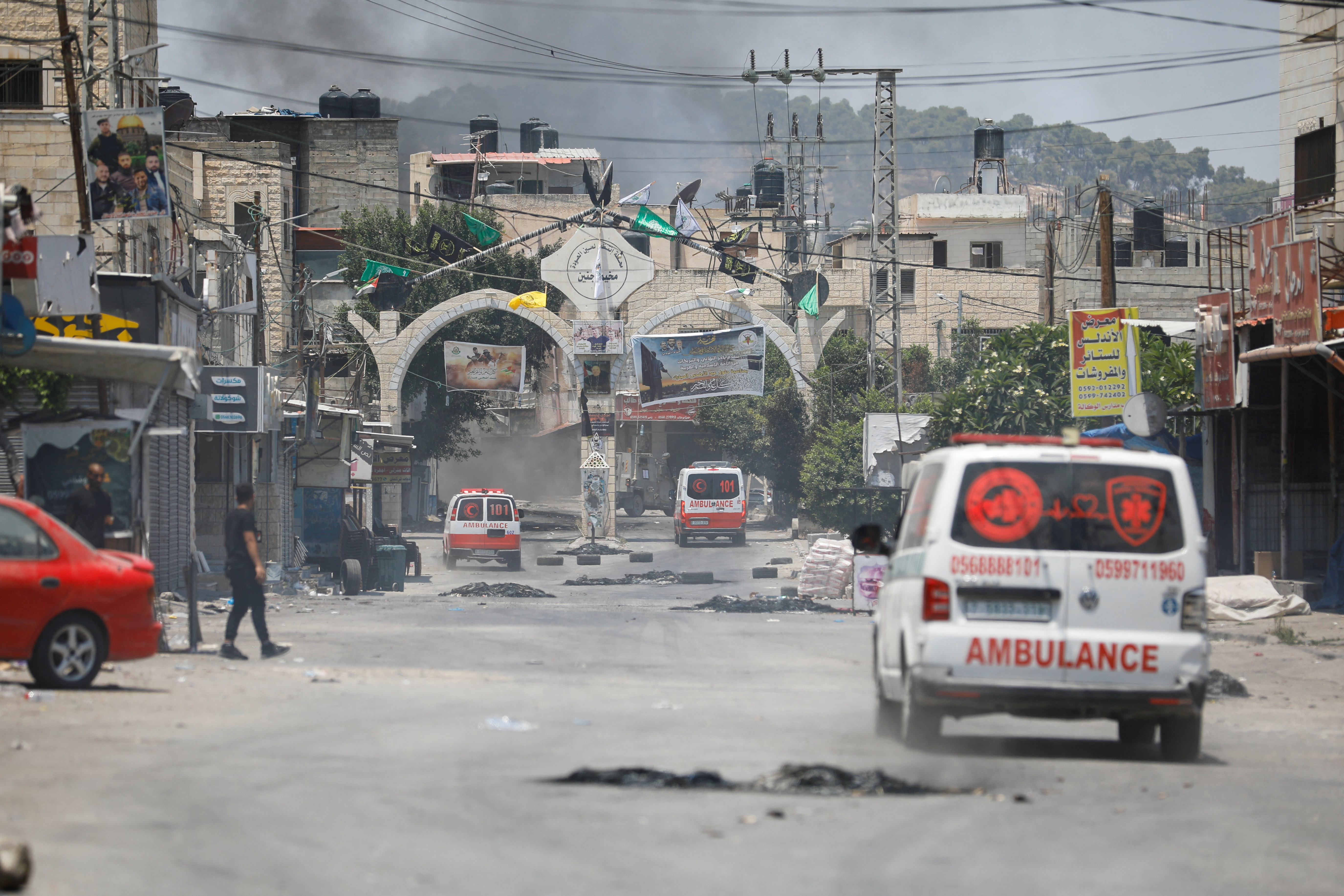 Palestinians clash with Israeli forces during an Israeli military operation in Jenin