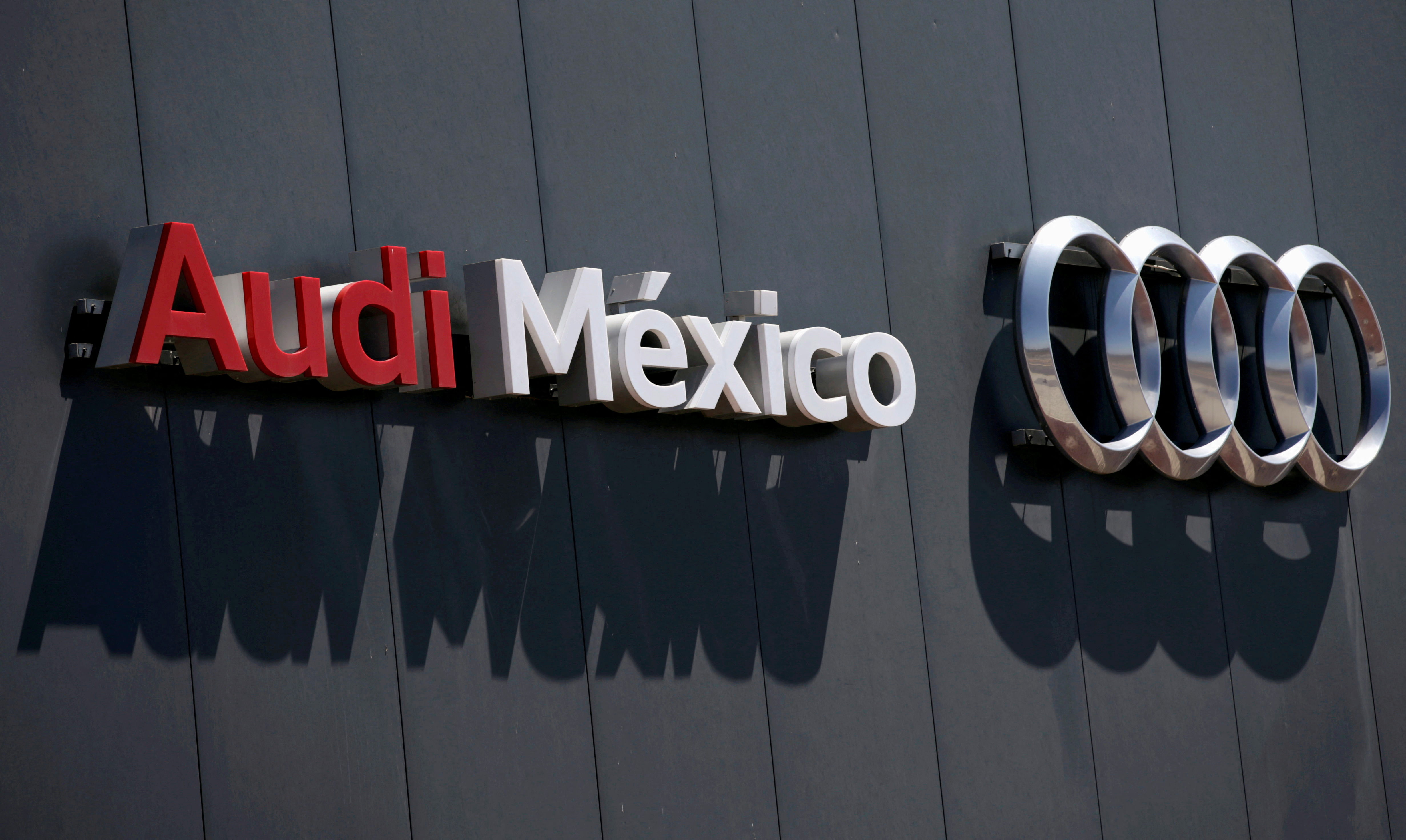 The logo of the German car manufacturer Audi is pictured on the wall of the plant during a media tour in San Jose Chiapa