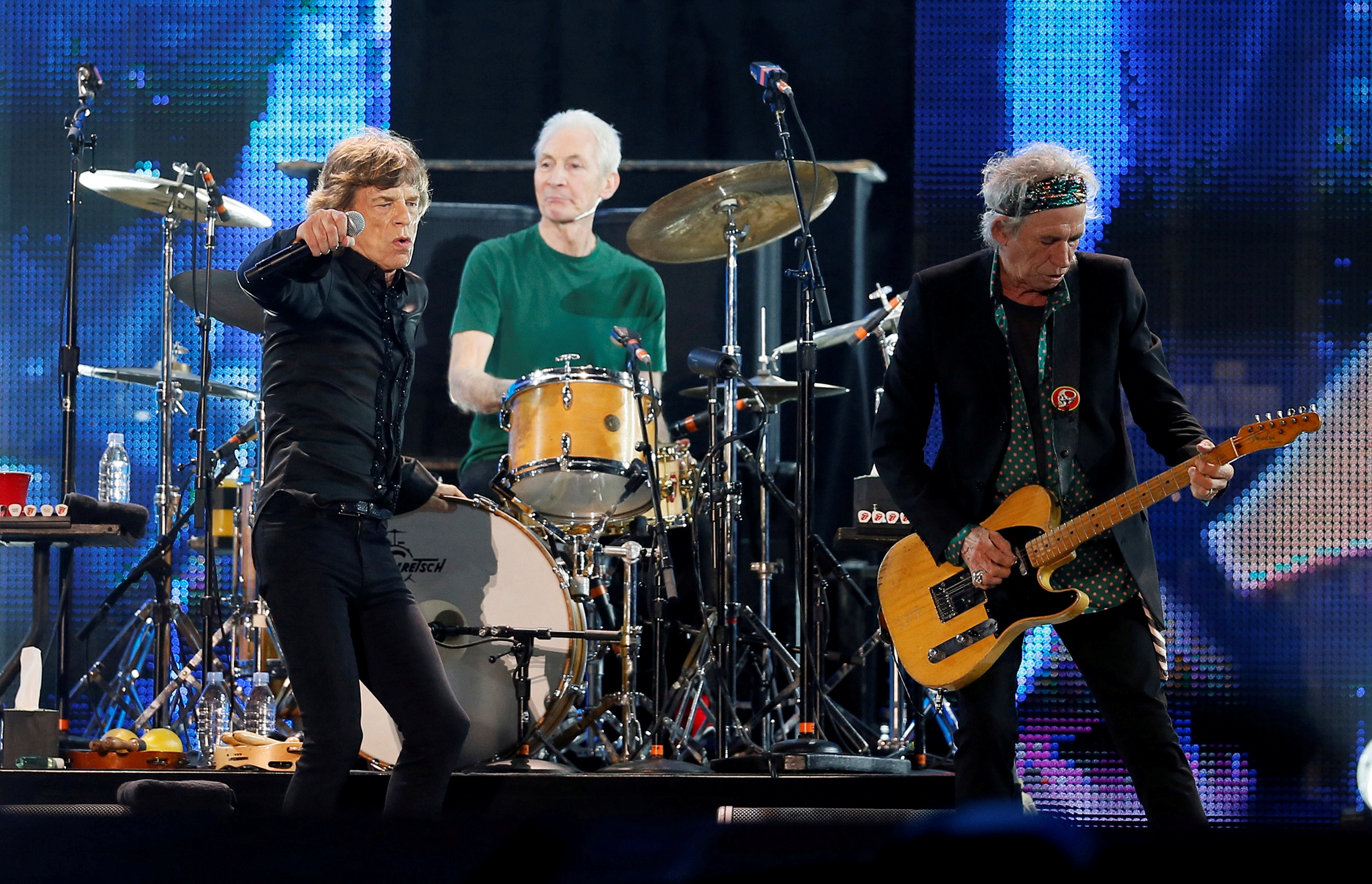 Mick Jagger, Charlie Watts and Keith Richards of the Rolling Stones perform during a concert in Abu Dhabi