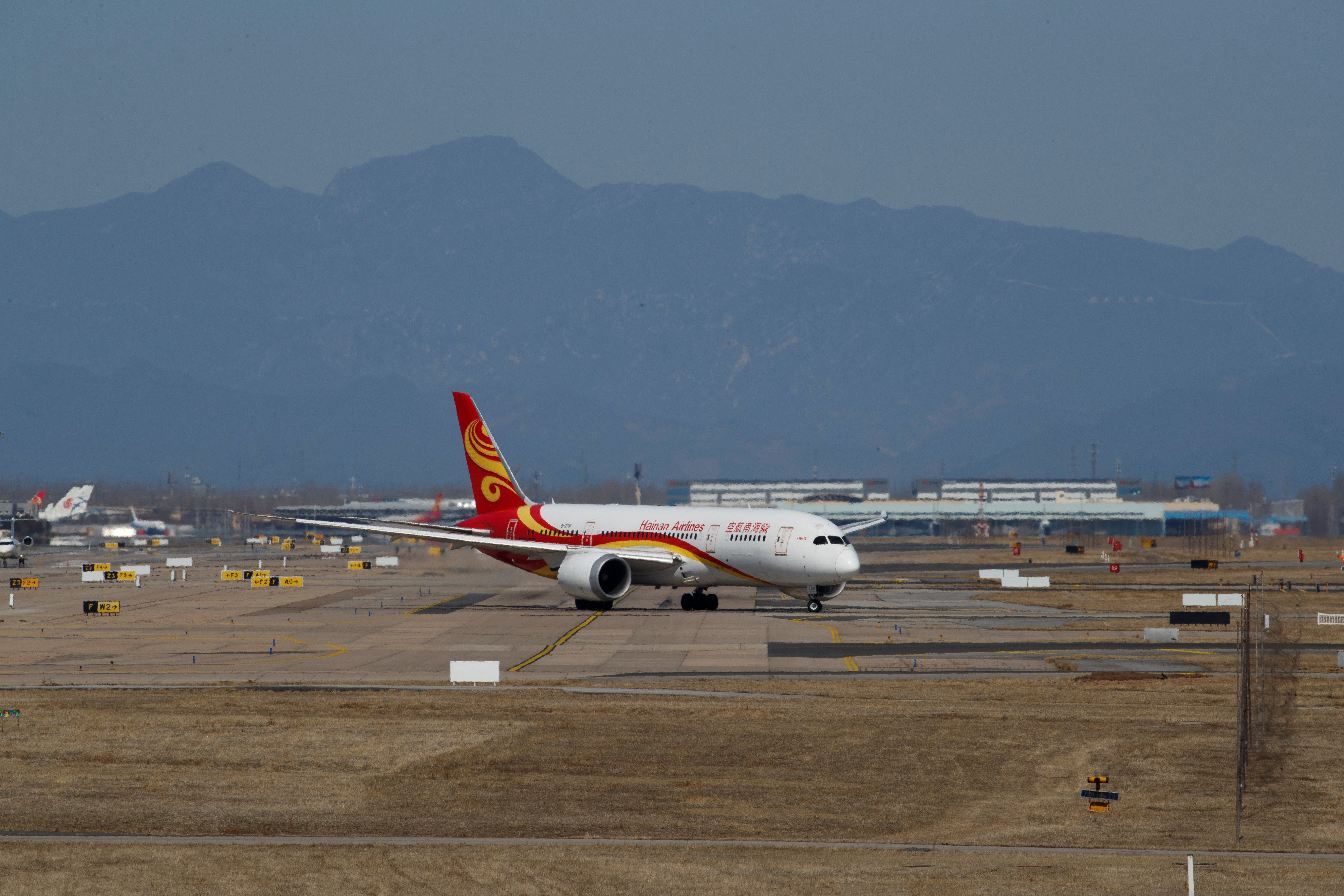 A plane of Hainan Airlines taxies at Beijing Capital International in Beijing as the country is hit by an outbreak of the novel coronavirus