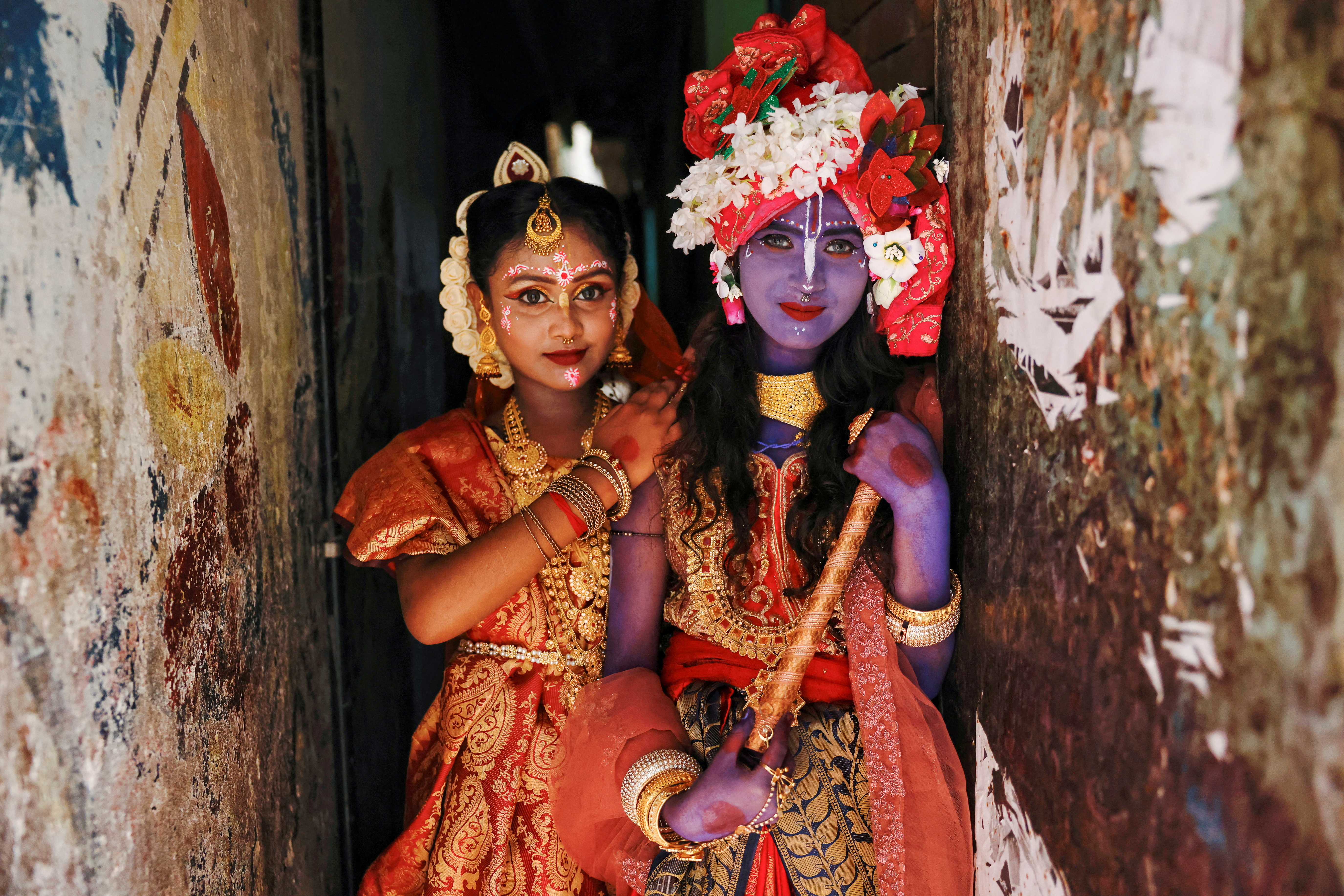 Hindu girls dress up as Radha and Lord Krishna during the Janmashtami festival in Dhaka