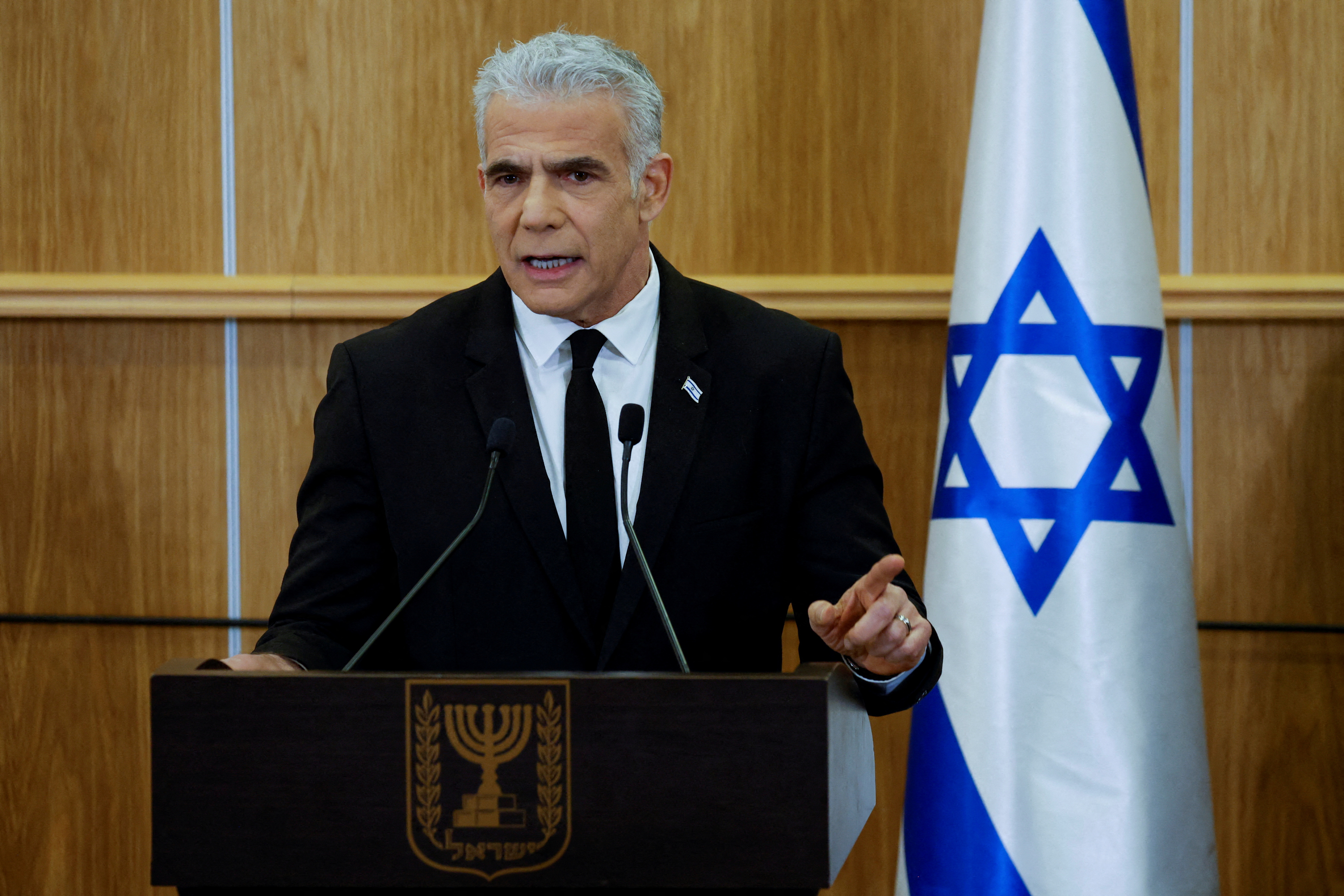 Israeli opposition head Yair Lapid delivers a statement at the Knesset, in Jerusalem