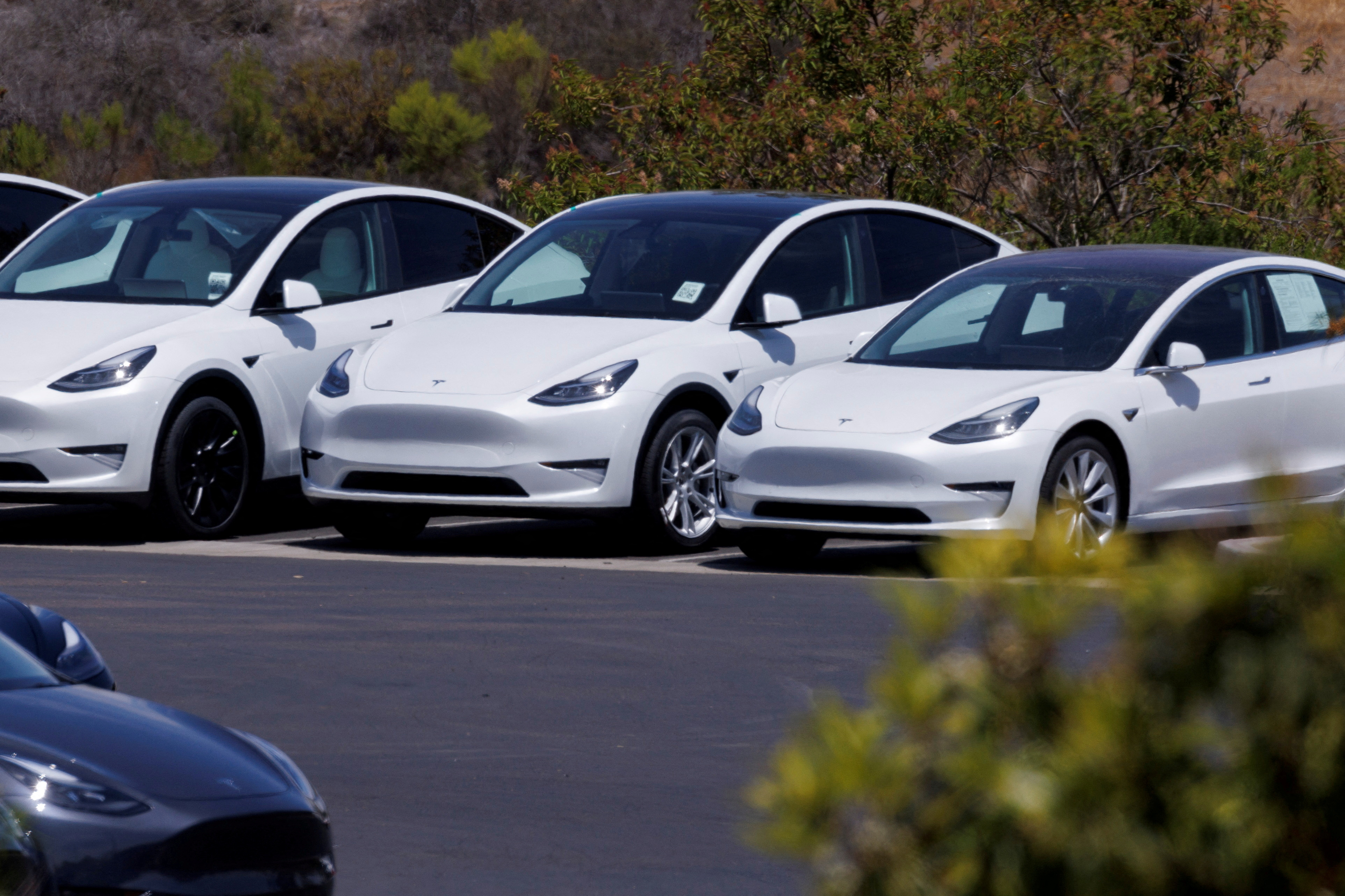 Tesla electric vehicles are shown at a sales and service center in Vista, California