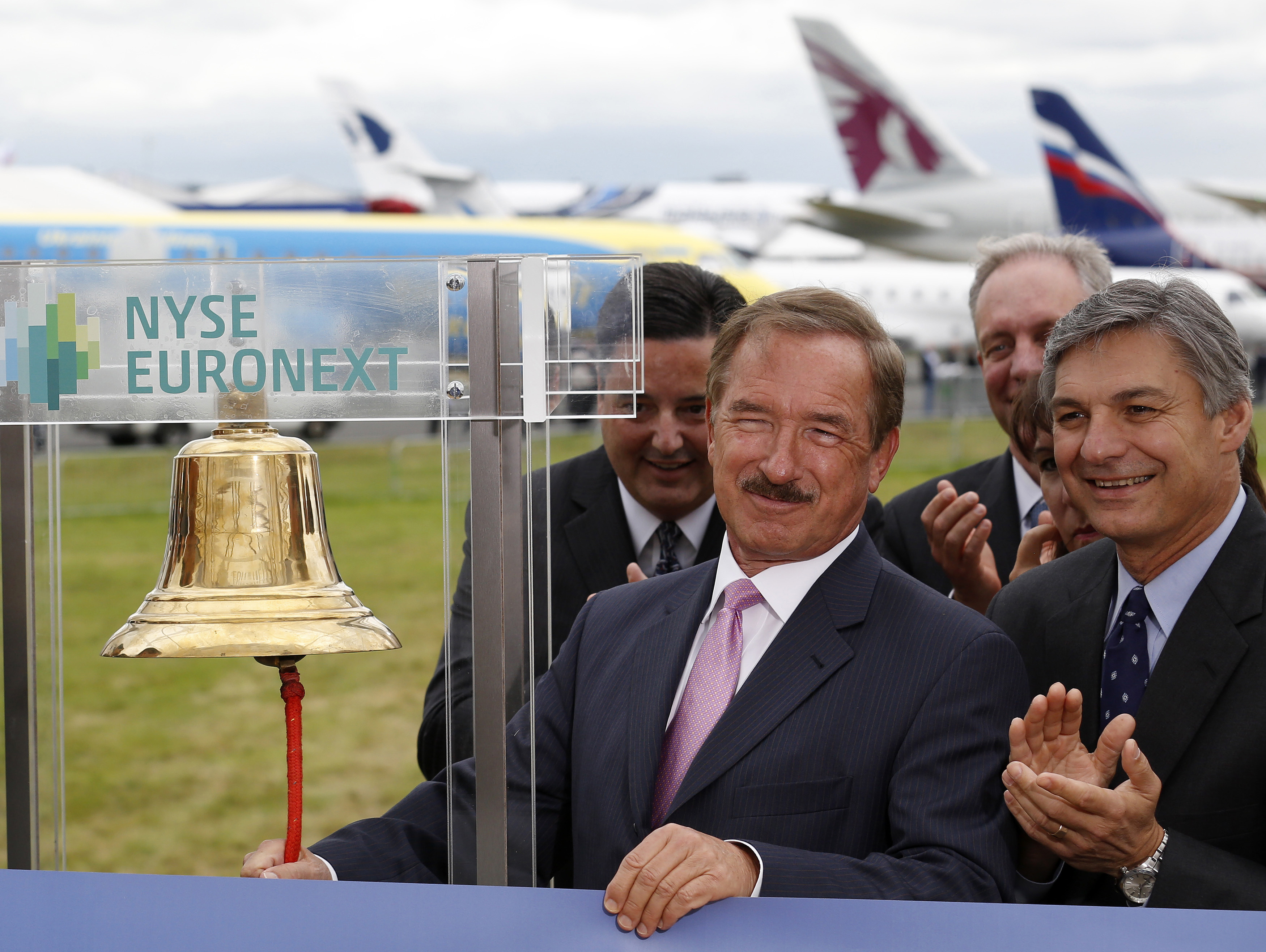 CEO of Air Lease Corp. Steven Udvar-Hazy rings the New York Stock Exchange bell alongside CEO of Boeing Commercial Airplanes Ray Conner at the Farnborough Airshow 2012 in southern England