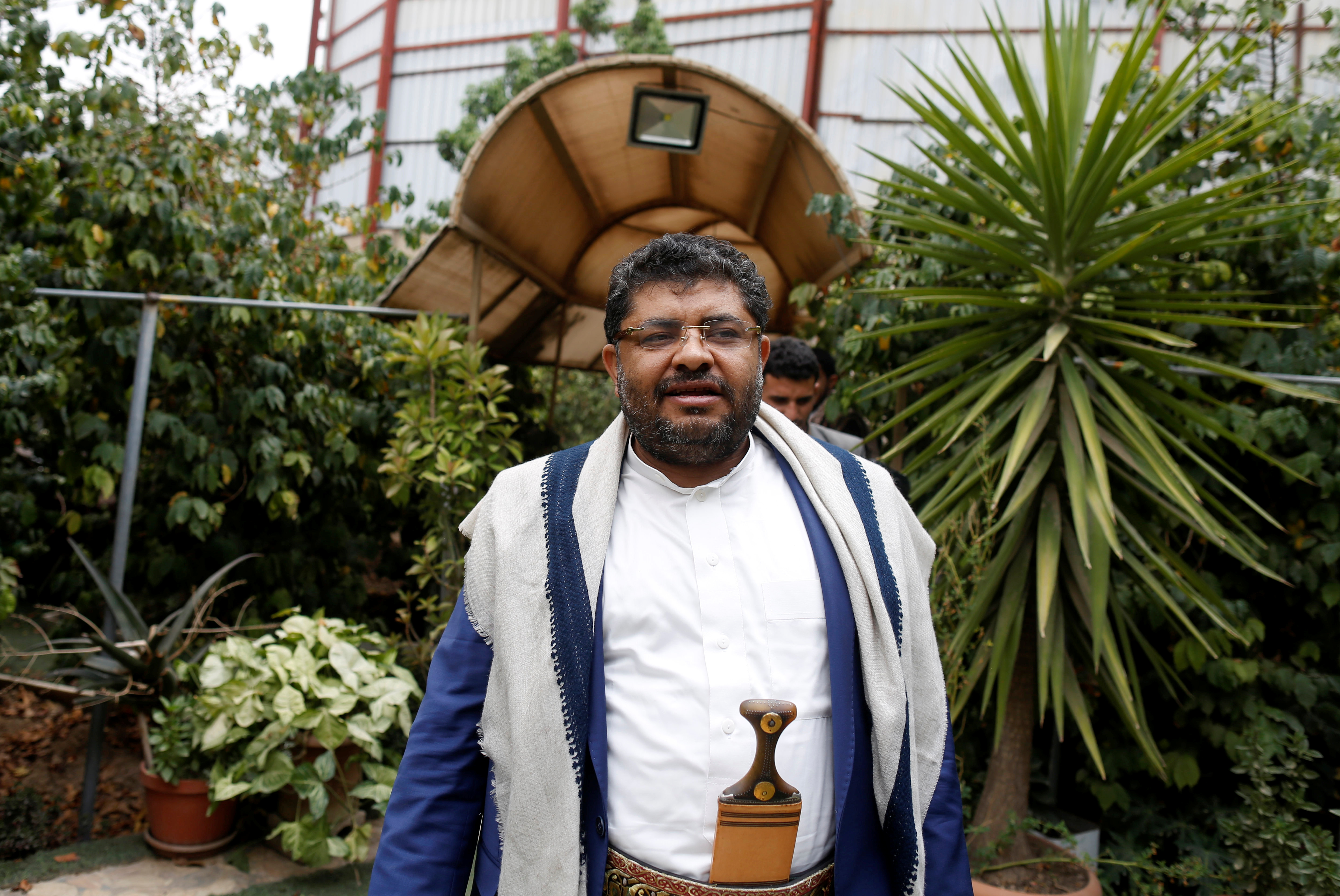 Mohamed Ali al-Houthi, head of the Houthi supreme revolutionary committee, walks after an interview with Reuters in Sanaa