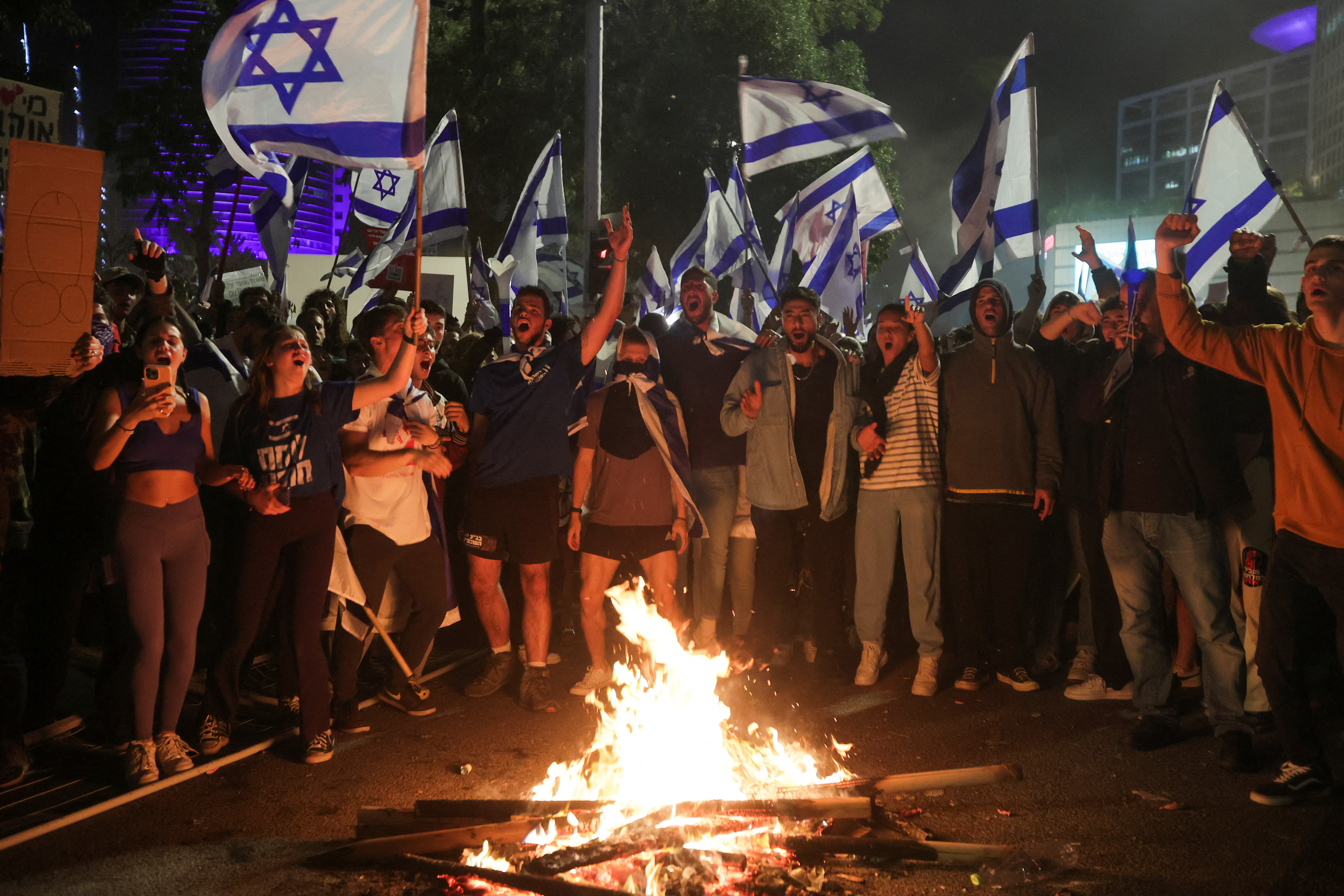 Protesters attend a demonstration against Israeli Prime Minister Benjamin Netanyahu and his nationalist coalition government's plan for judicial overhaul, in Tel Aviv