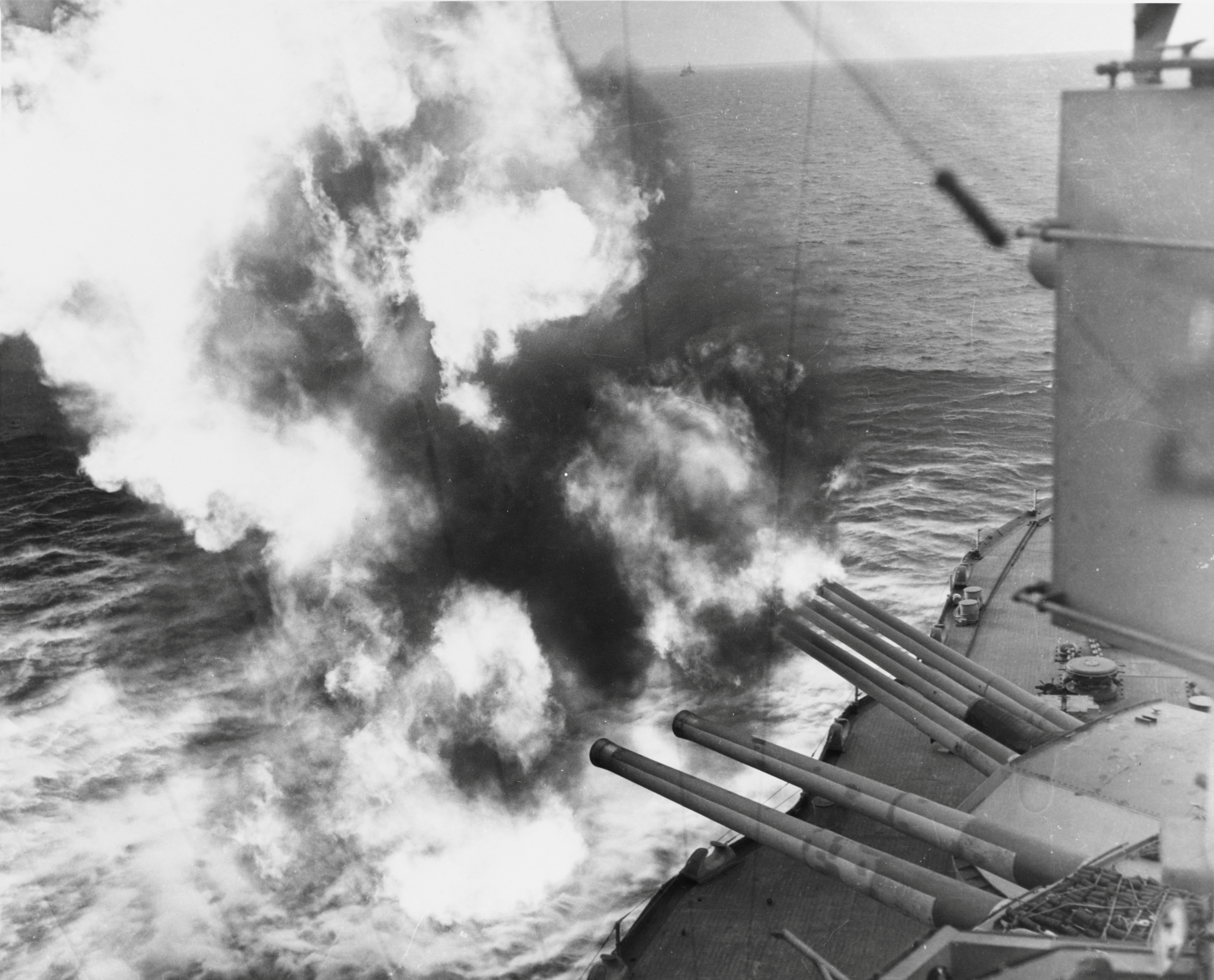 Forward 14/45 guns of the U.S. Navy battleship USS Nevada fire on positions ashore during the D-Day landings on Utah Beach in Normandy
