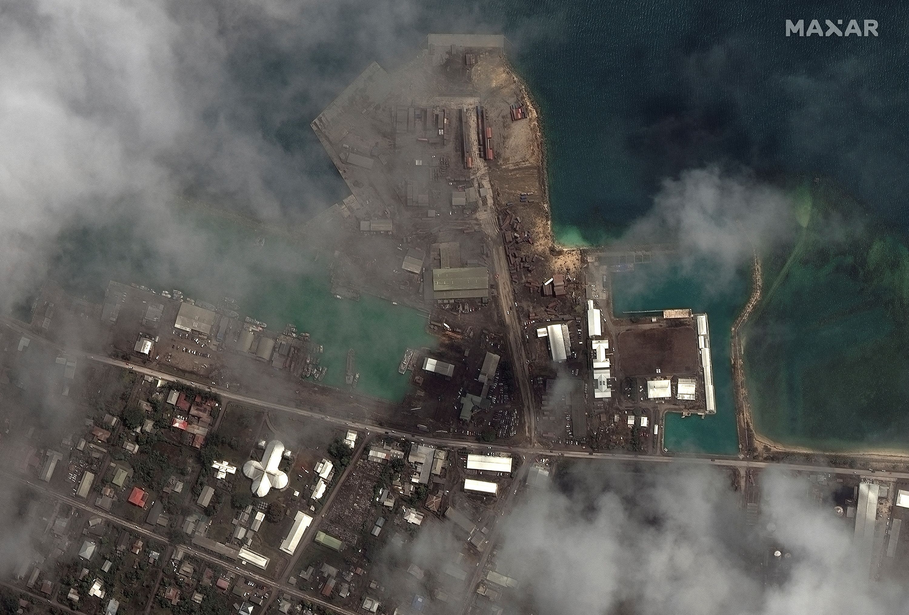 A satellite image shows the main port facilites after the main eruption of the Hunga Tonga-Hunga Ha'apai volcano, in Nuku'alofa