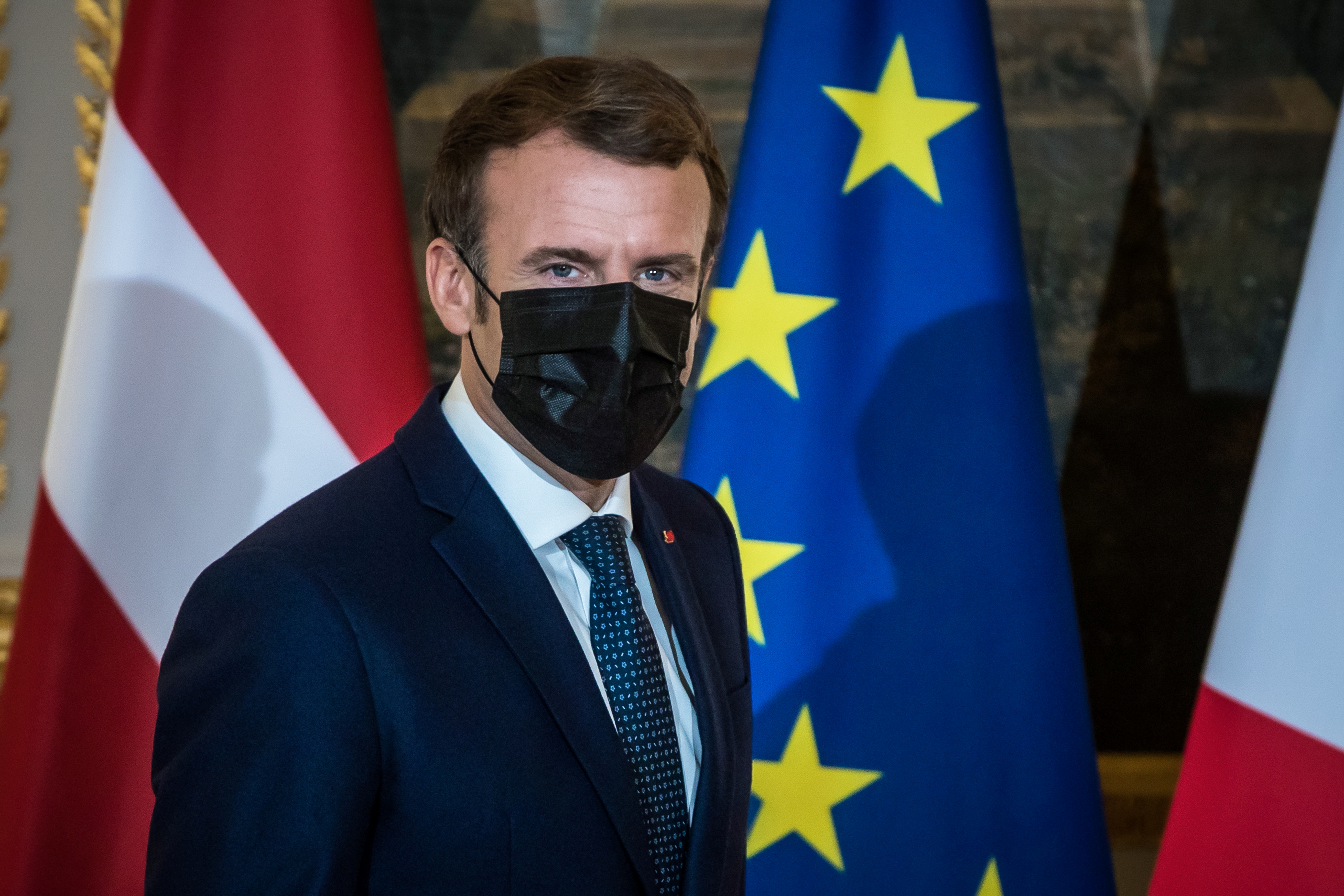 French President Emmanuel Macron wears a face mask as he arrives to deliver a statement with Latvian Prime Minister Krisjanis Karins at the Elysee Palace in Paris, France, December 1, 2021. Christophe Petit Tesson/Pool via REUTERS
