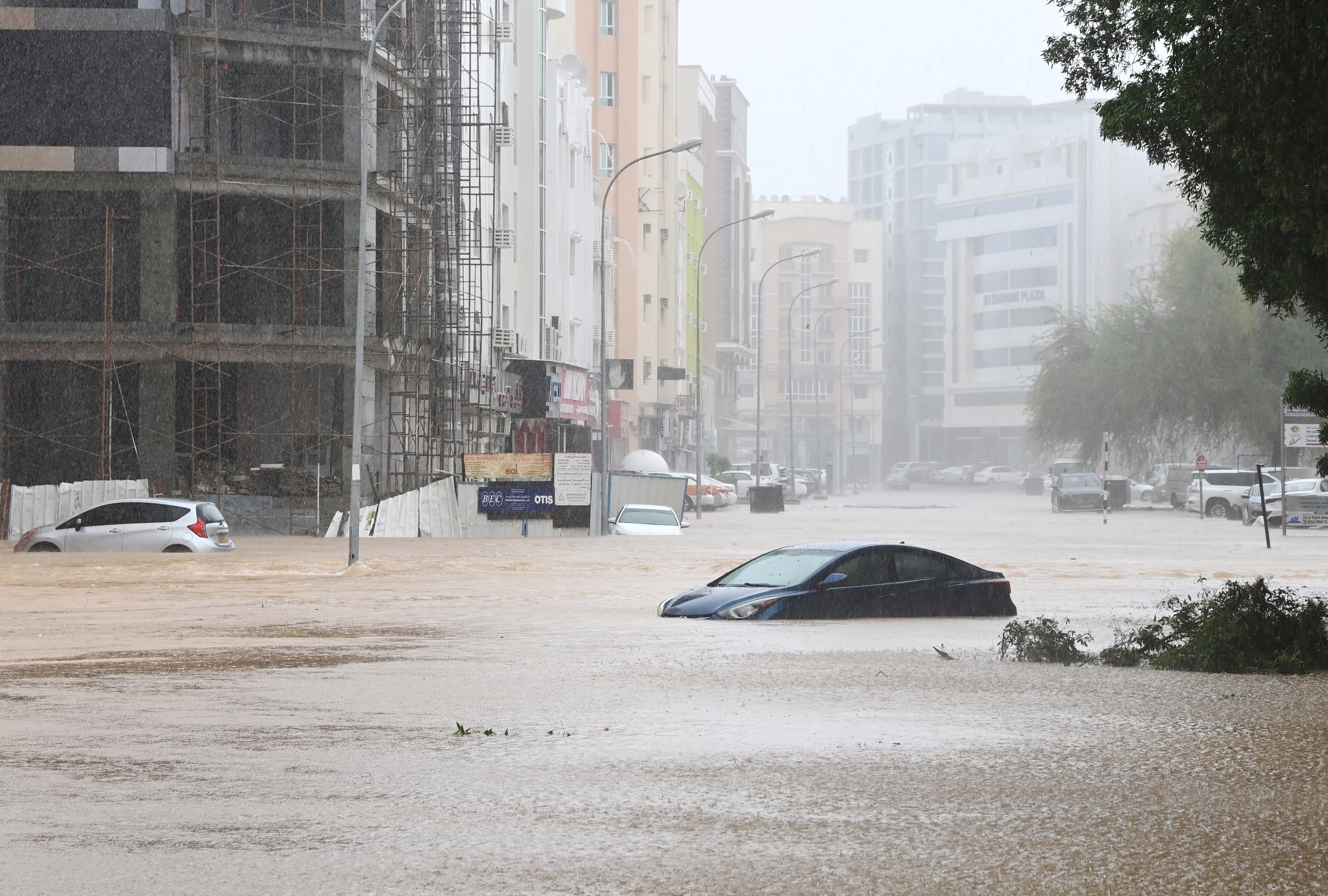 Cars are seen abandoned on a flooded street as Cyclone Shaheen makes landfall in Muscat Oman, October 3, 2021. REUTERS/Sultan Al Hassani NO RESALES. NO ARCHIVES