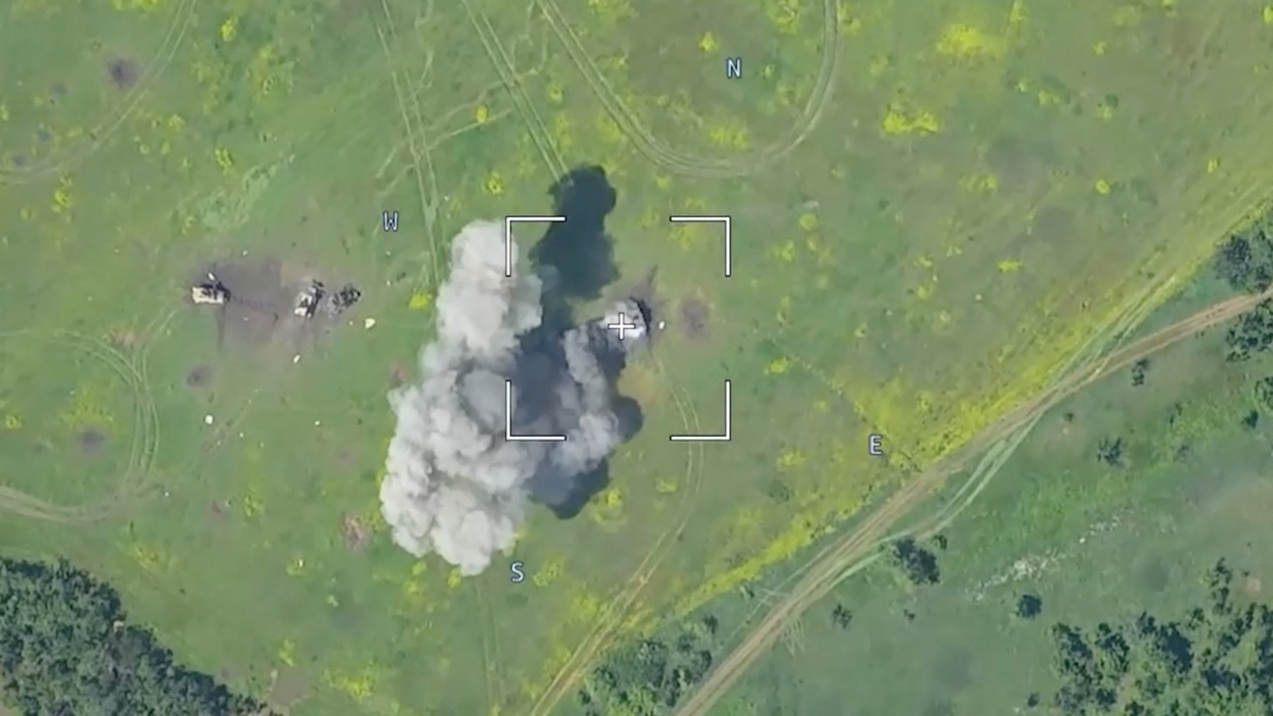 Drone footage shows a burning armoured vehicle in an unidentified location after the Defence Ministry in Moscow said that Russian forces have thwarted a major Ukrainian offensive in the Donetsk region