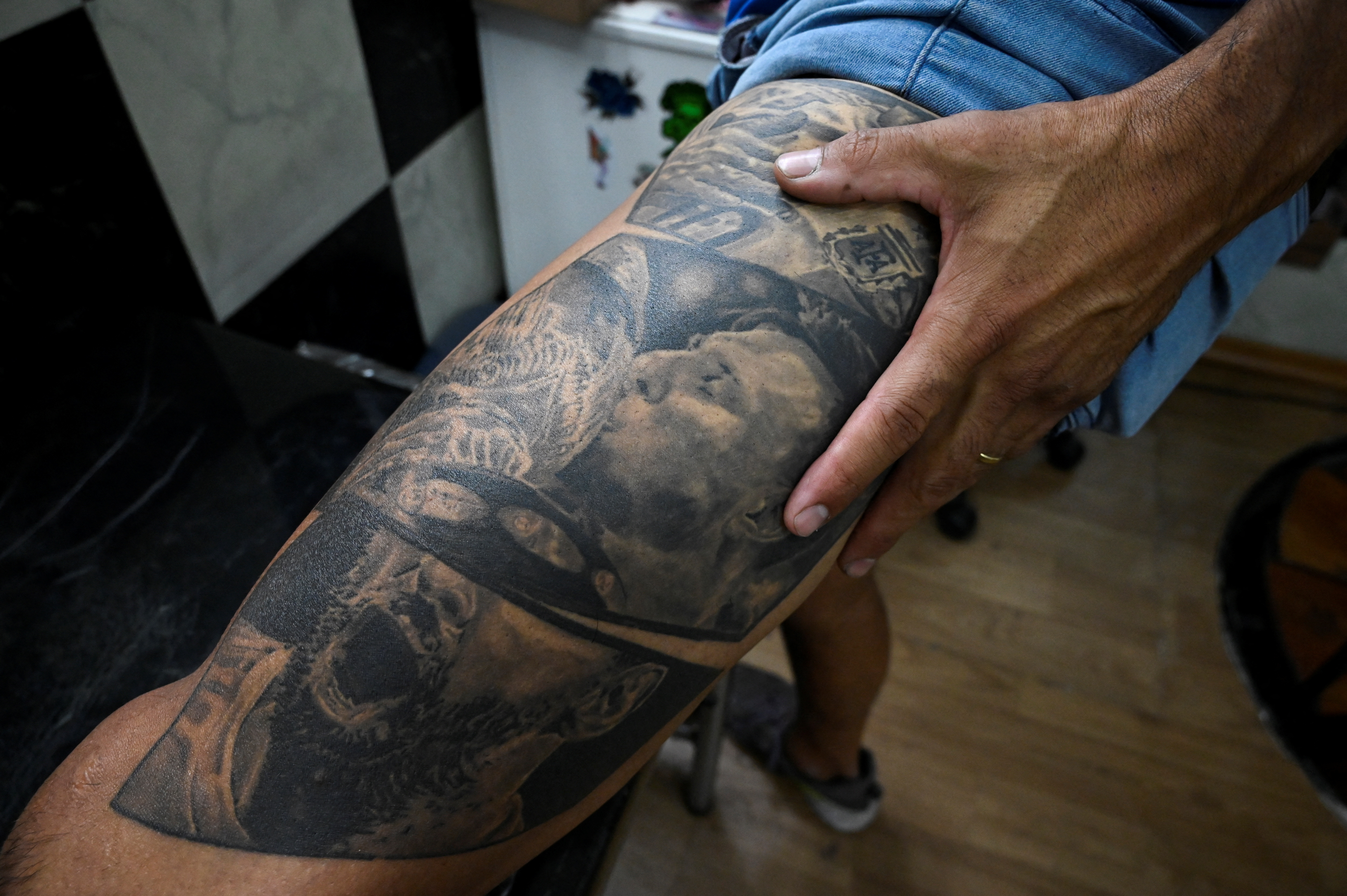 Microrealistic style World Cup trophy tattooed on the